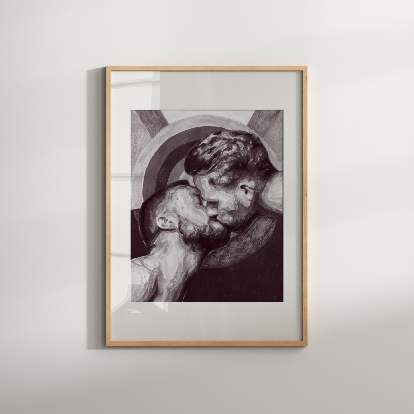 Framed artwork of a couple embracing on a white wall