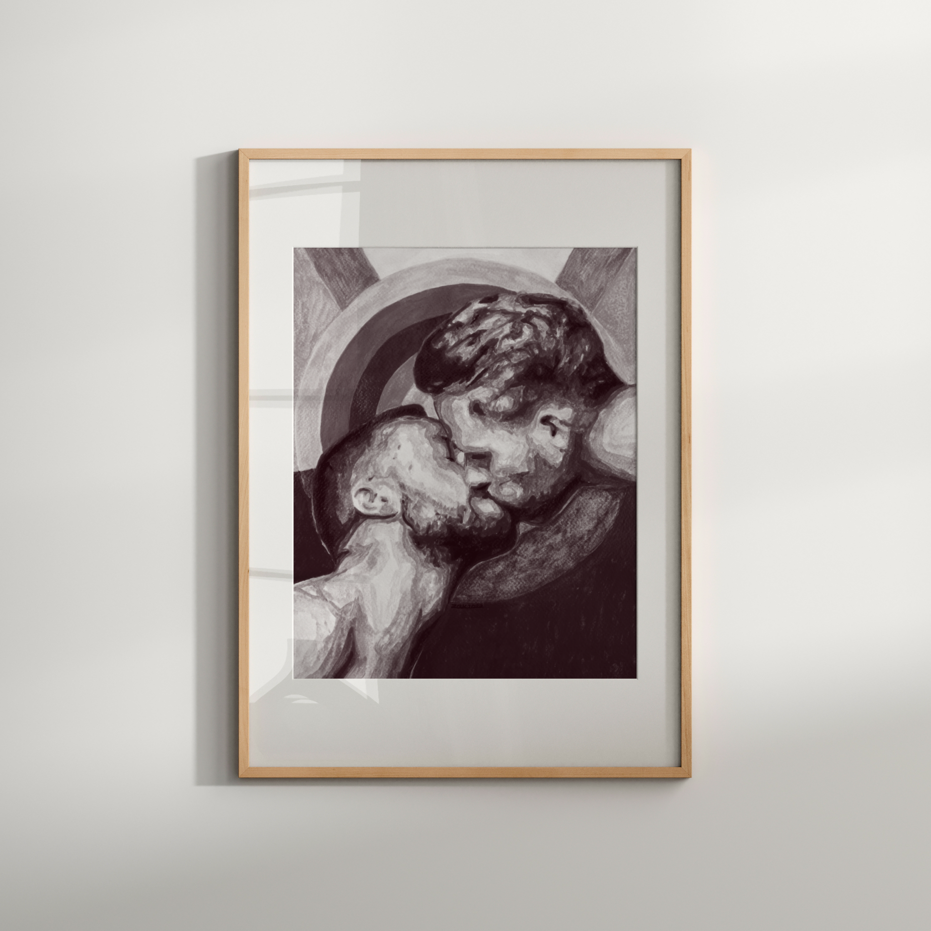 Framed artwork of a couple embracing on a white wall