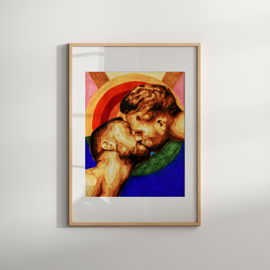 Framed artwork of two figures embracing on a white wall