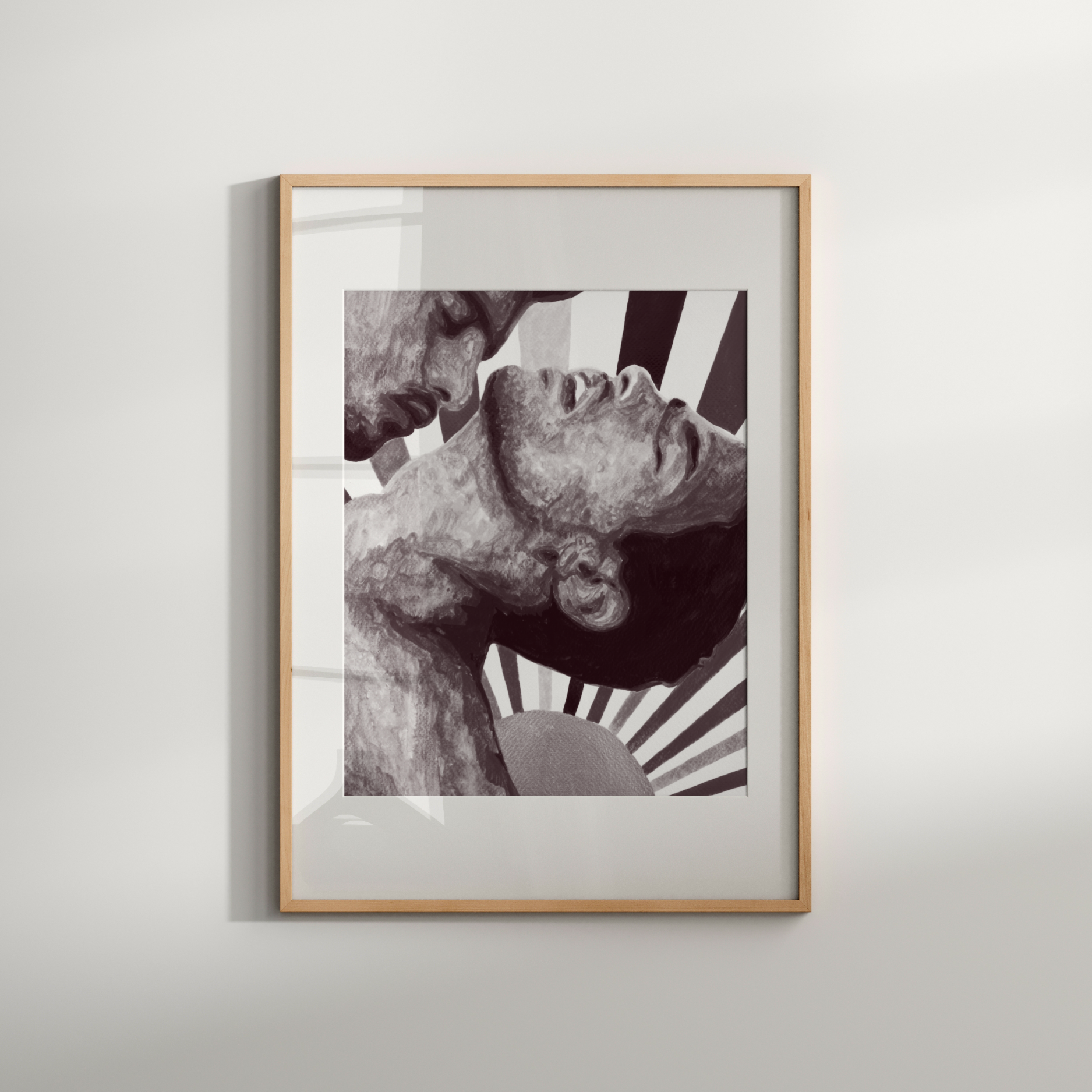 Framed black and white artwork on a light gray wall