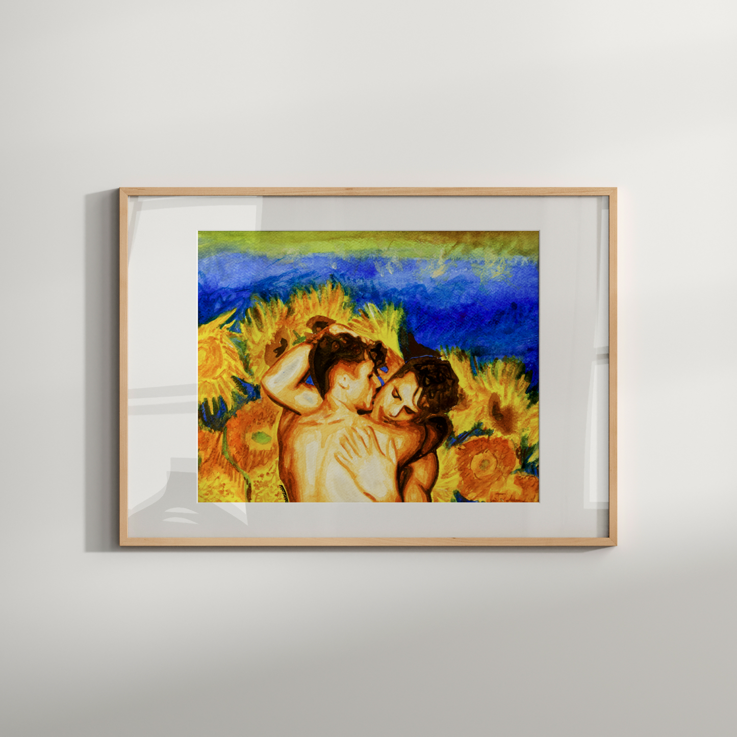 Framed artwork of two people embracing with sunflowers on a white wall