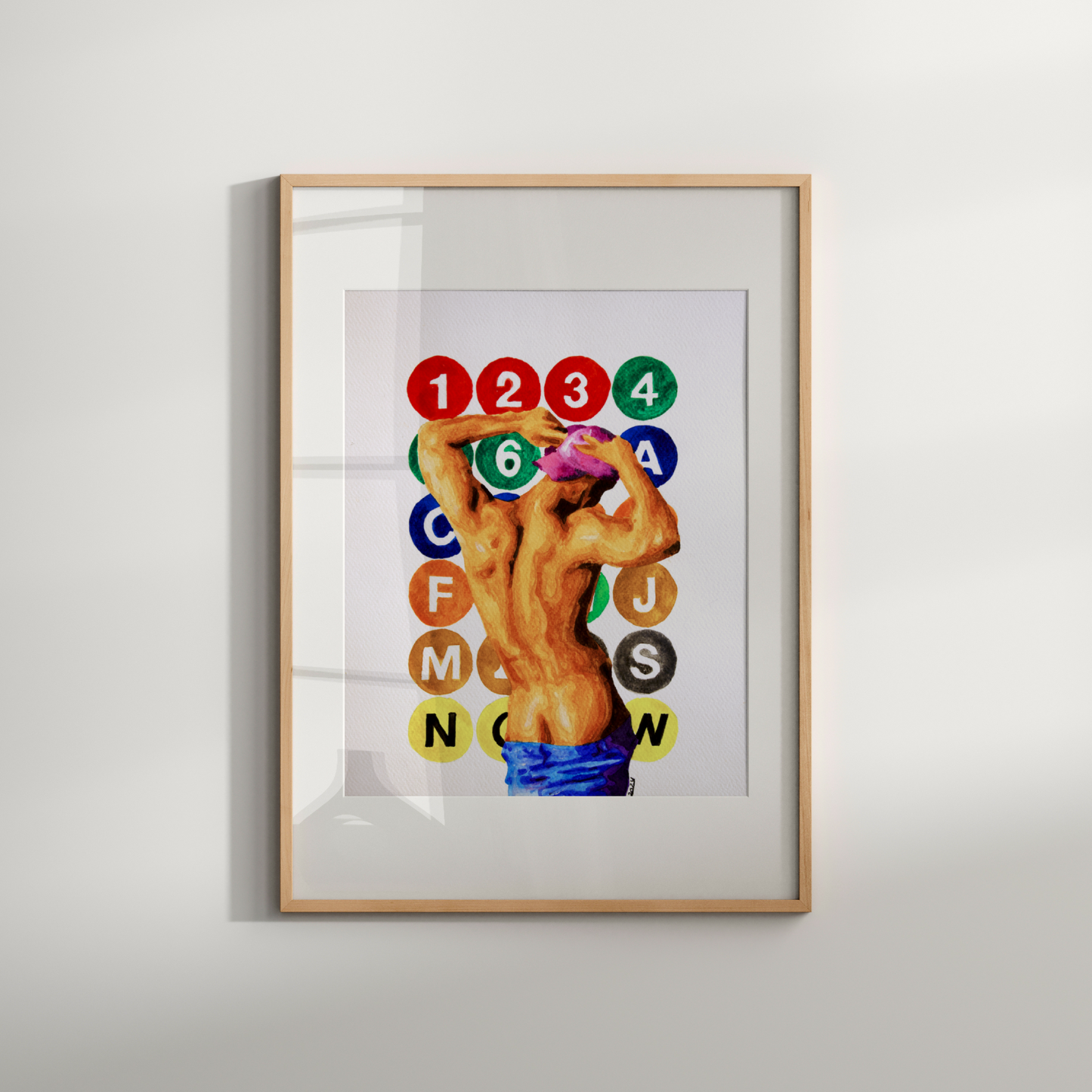 Framed artwork with a colorful design featuring numbers and letters on a white background