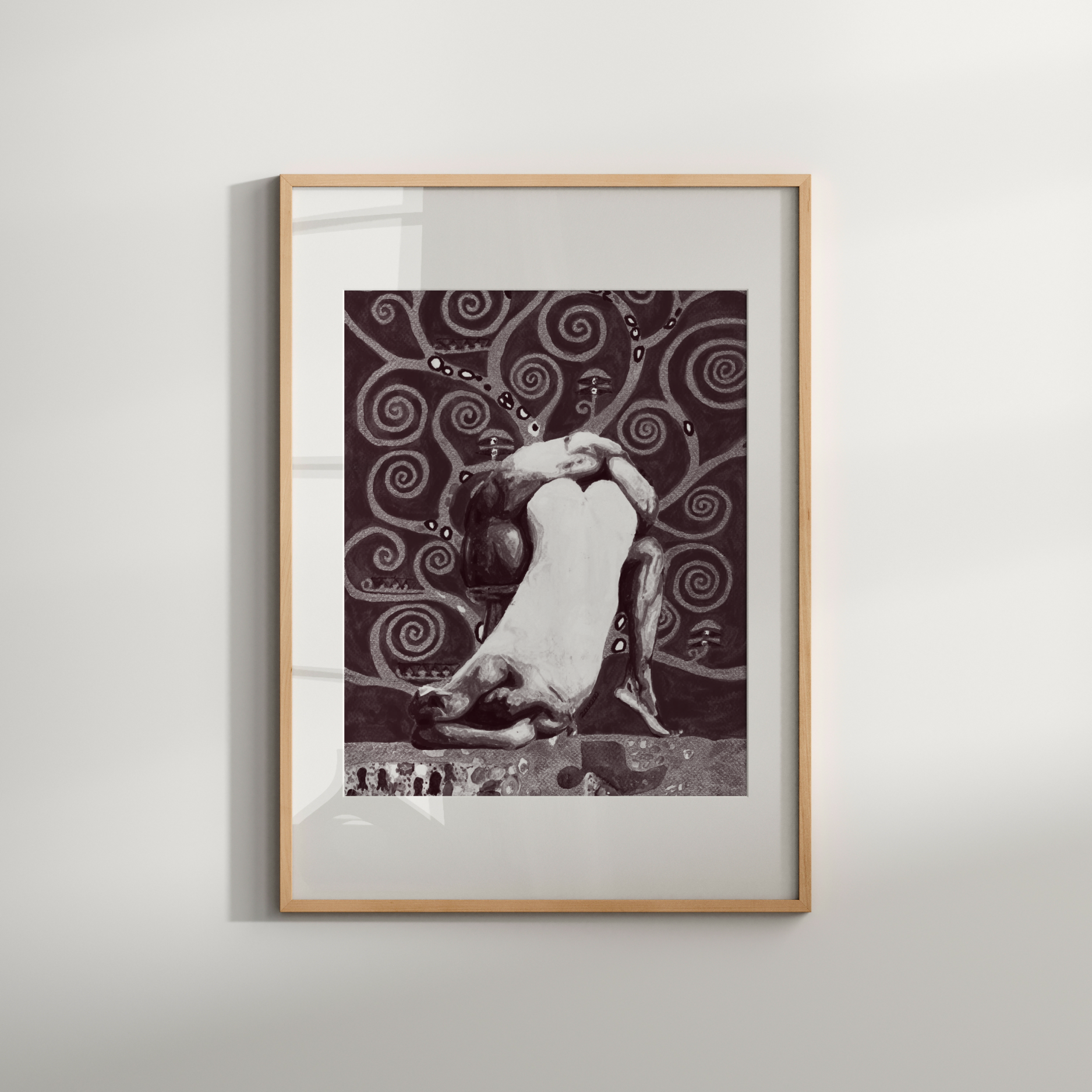 Framed black and white artwork on a light gray wall