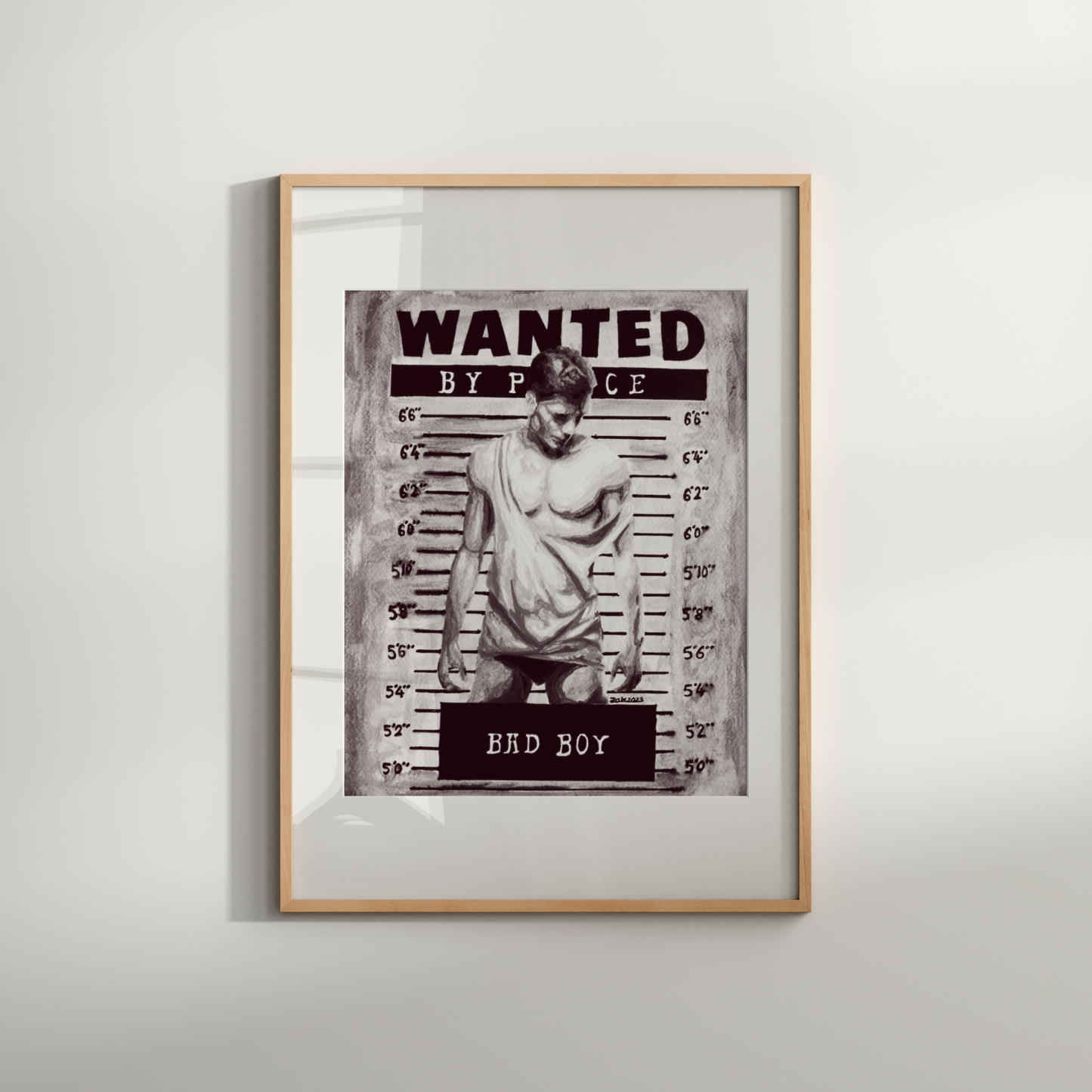 Framed 'Wanted' poster with a person on a white wall