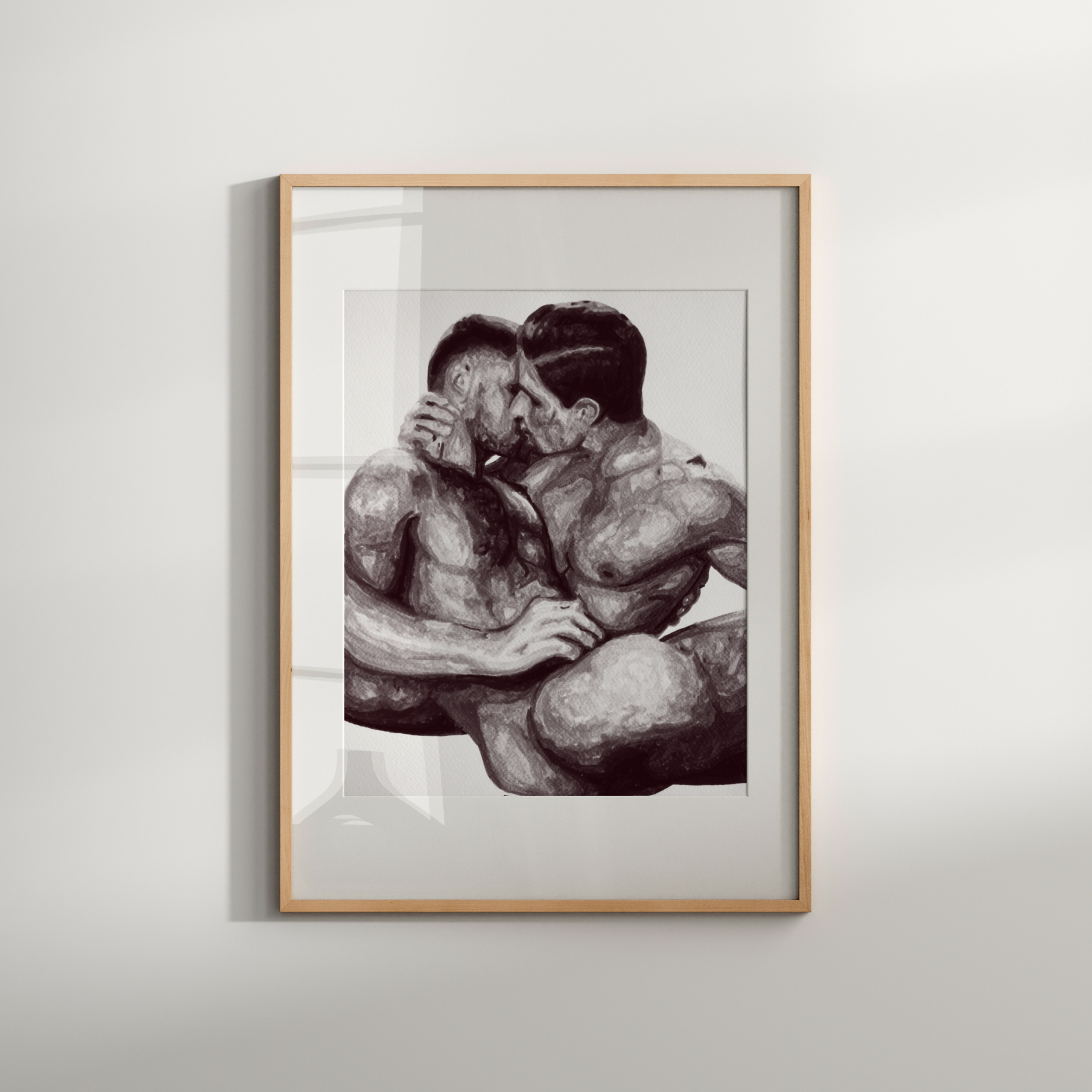 Framed artwork of two people embracing on a white wall