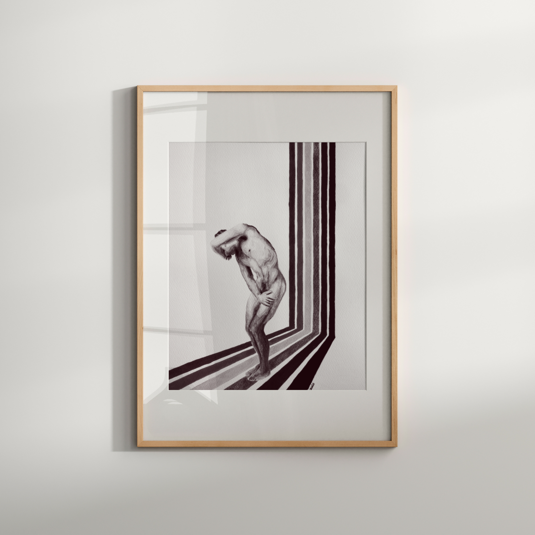 Framed artwork of a nude figure in a minimalist setting on a white wall