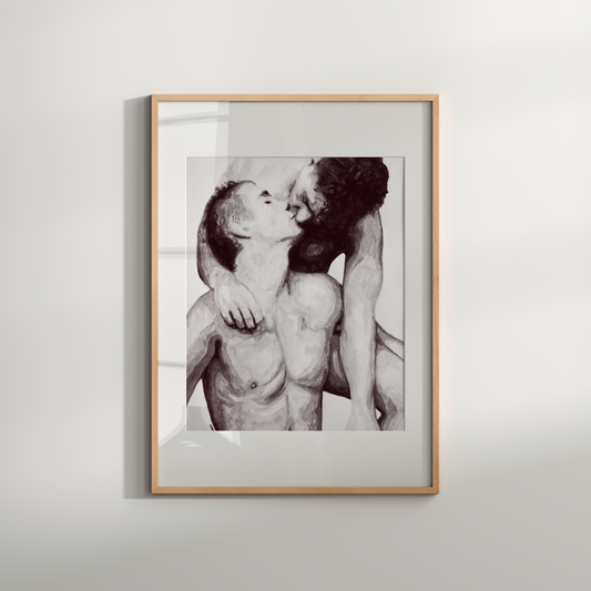 Framed black and white photograph of two people embracing on a light gray background