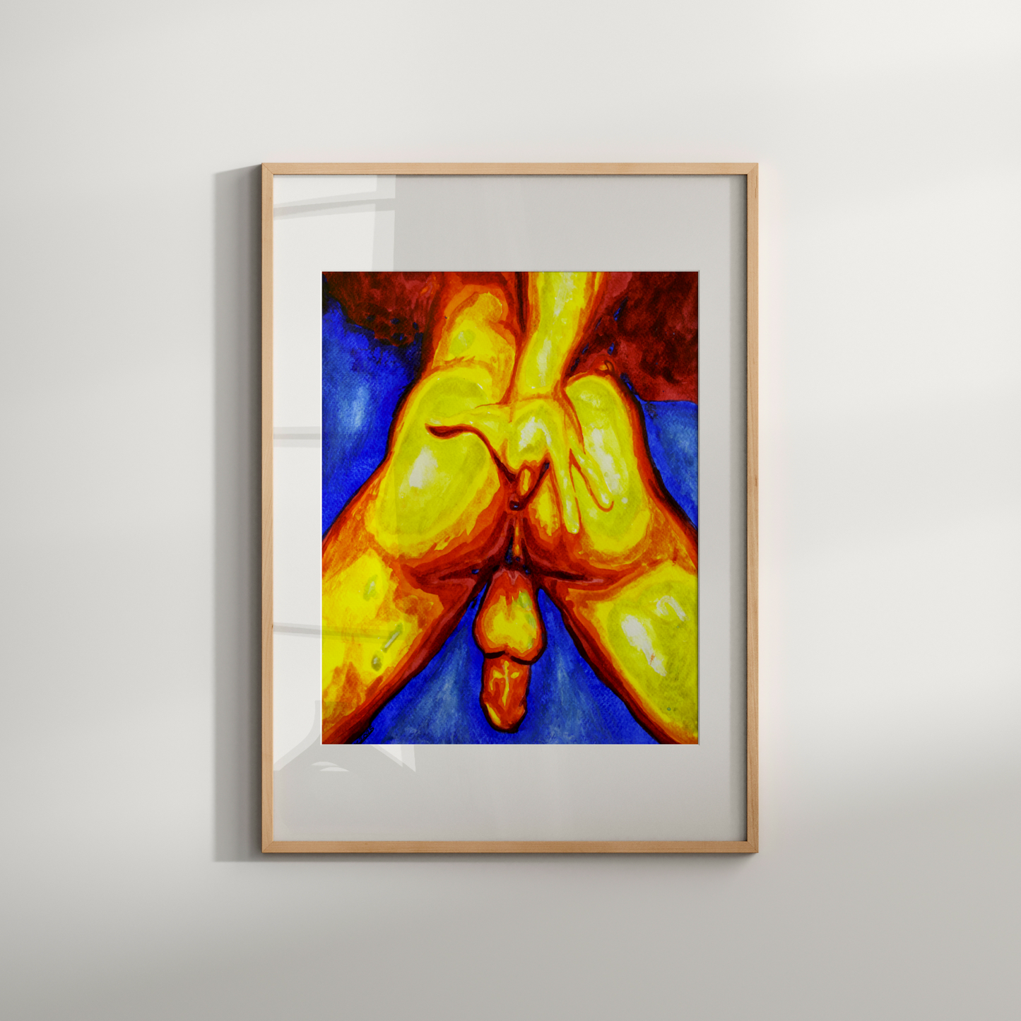 Framed abstract artwork with vibrant colors on a white wall