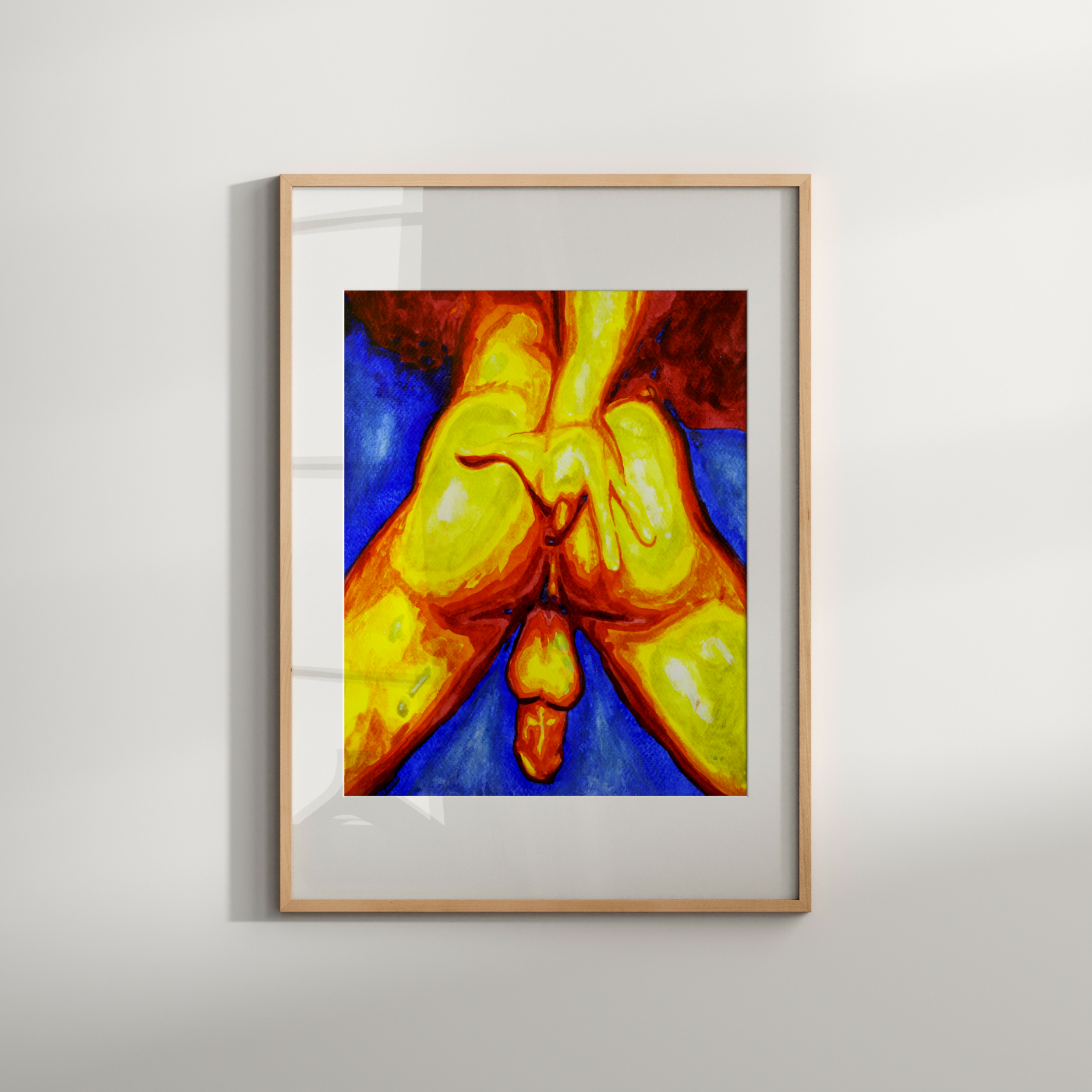 Framed abstract artwork with vibrant colors on a white wall