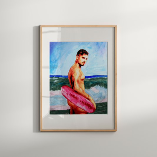 Framed artwork of a man holding a pink inner tube against a beach backdrop.