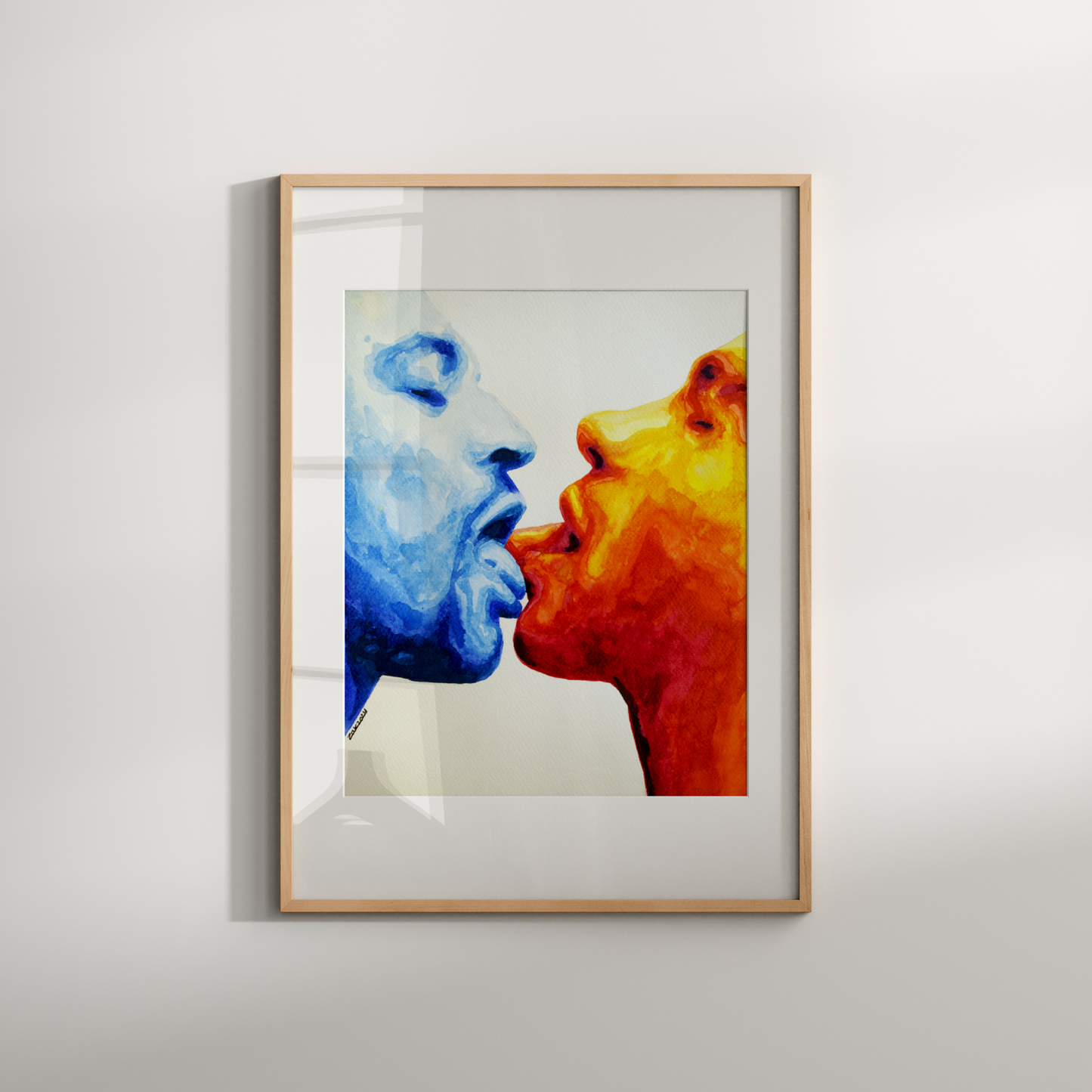 Framed artwork of two faces, one blue and one orange, against a white background.