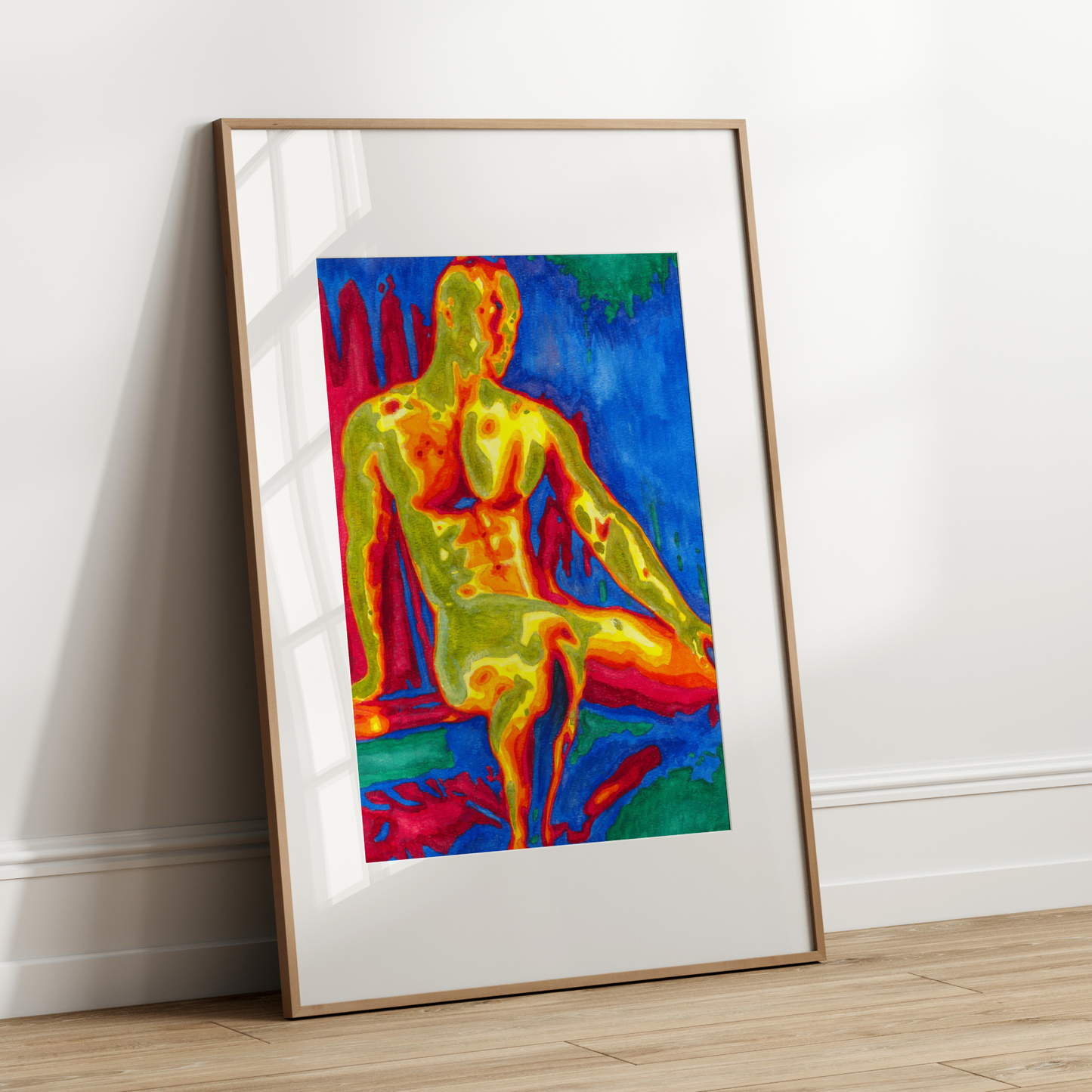 Framed thermogram of a human body on a white wall