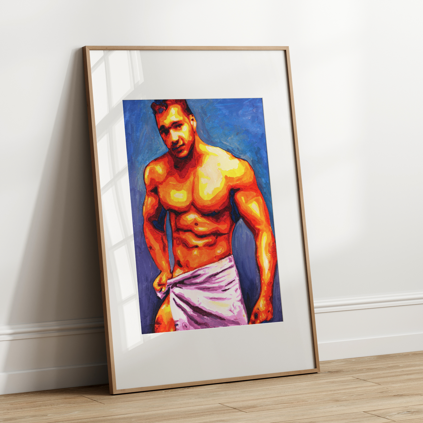 Framed artwork of a shirtless man with a towel draped over his shoulder on a white wall.