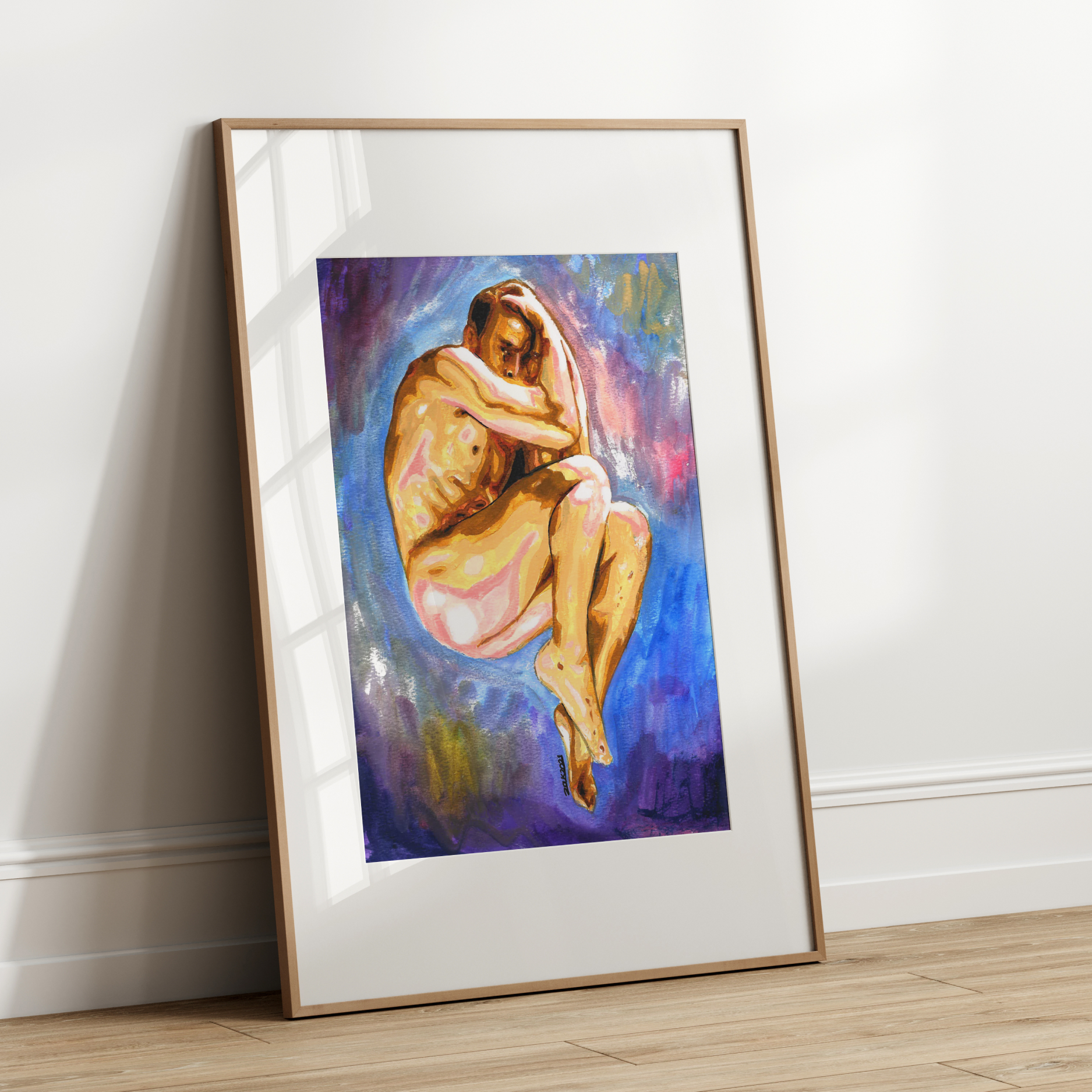 Framed artwork of a nude figure on a white wall