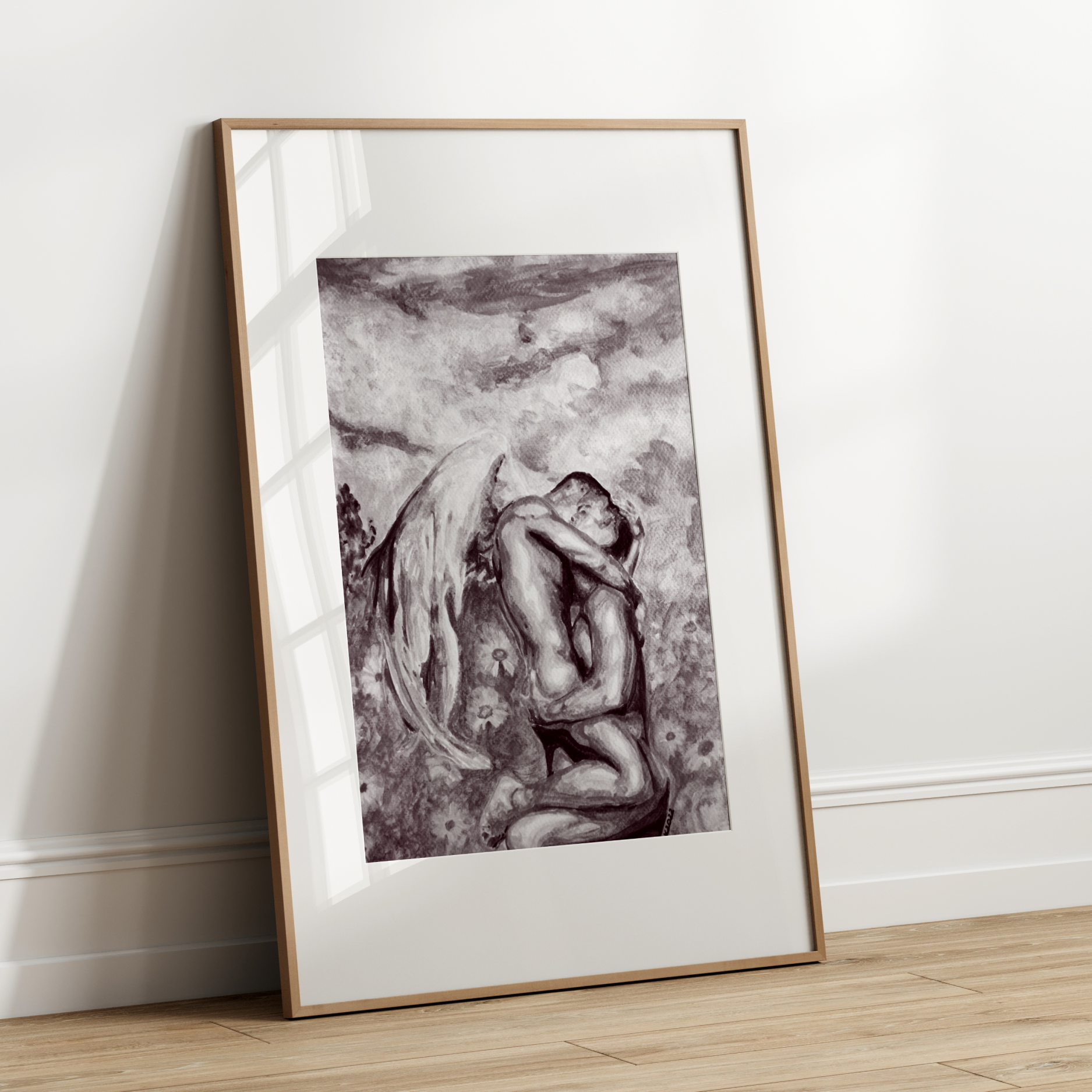 Framed artwork of a nude figure leaning against a wall on a wooden floor.