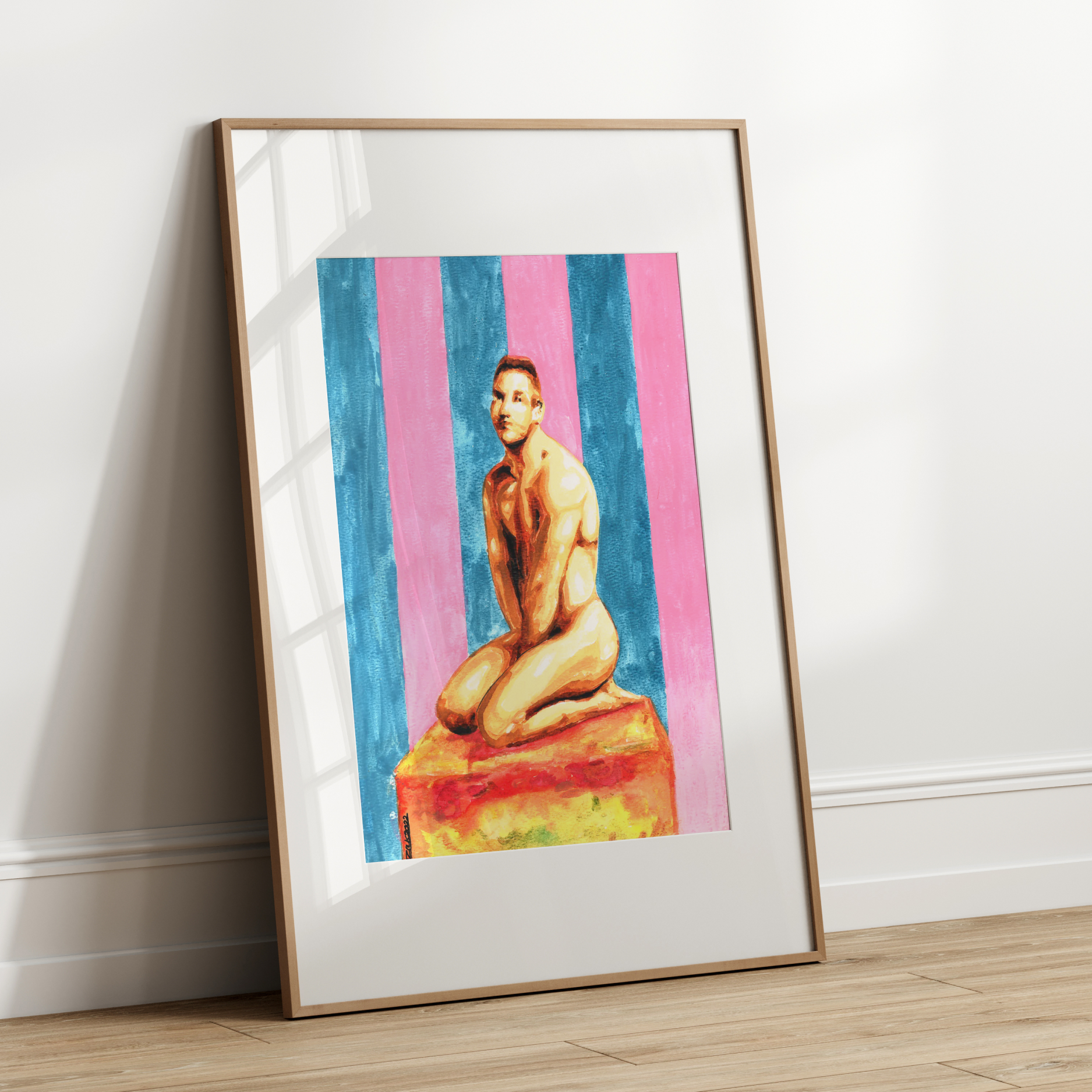 Framed artwork of a nude figure on a colorful striped background leaning against a white wall.