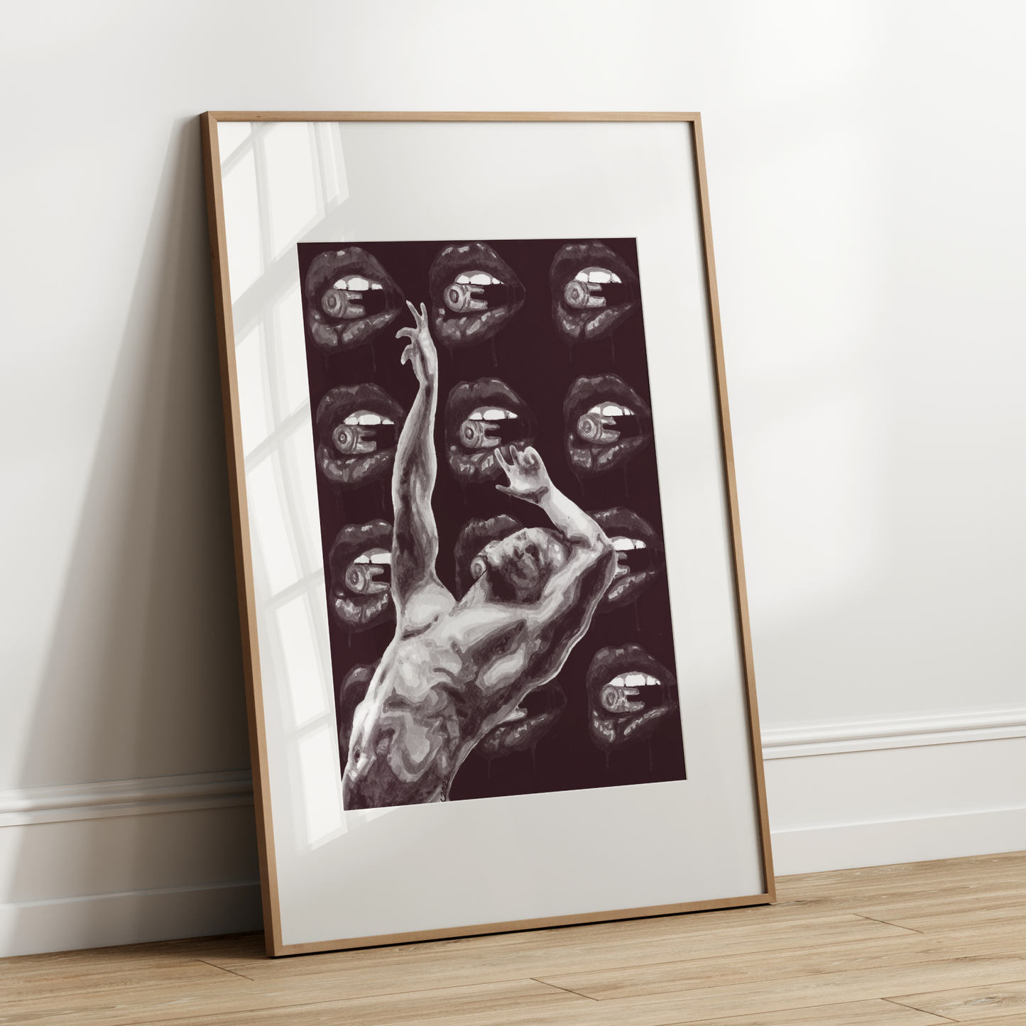 Framed artwork of a nude figure with eye patterns on a white wall.