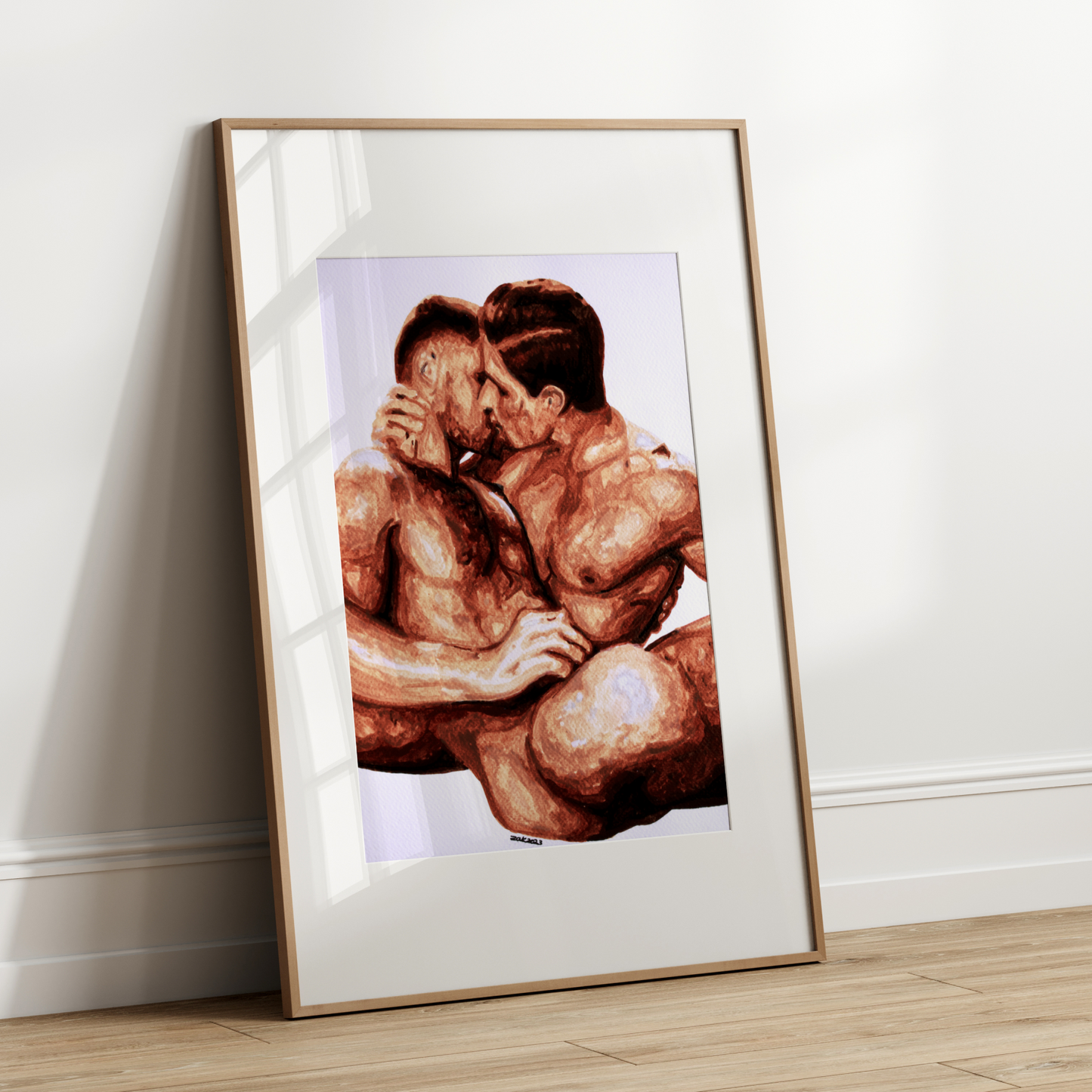 Framed artwork of a nude figure on a white wall