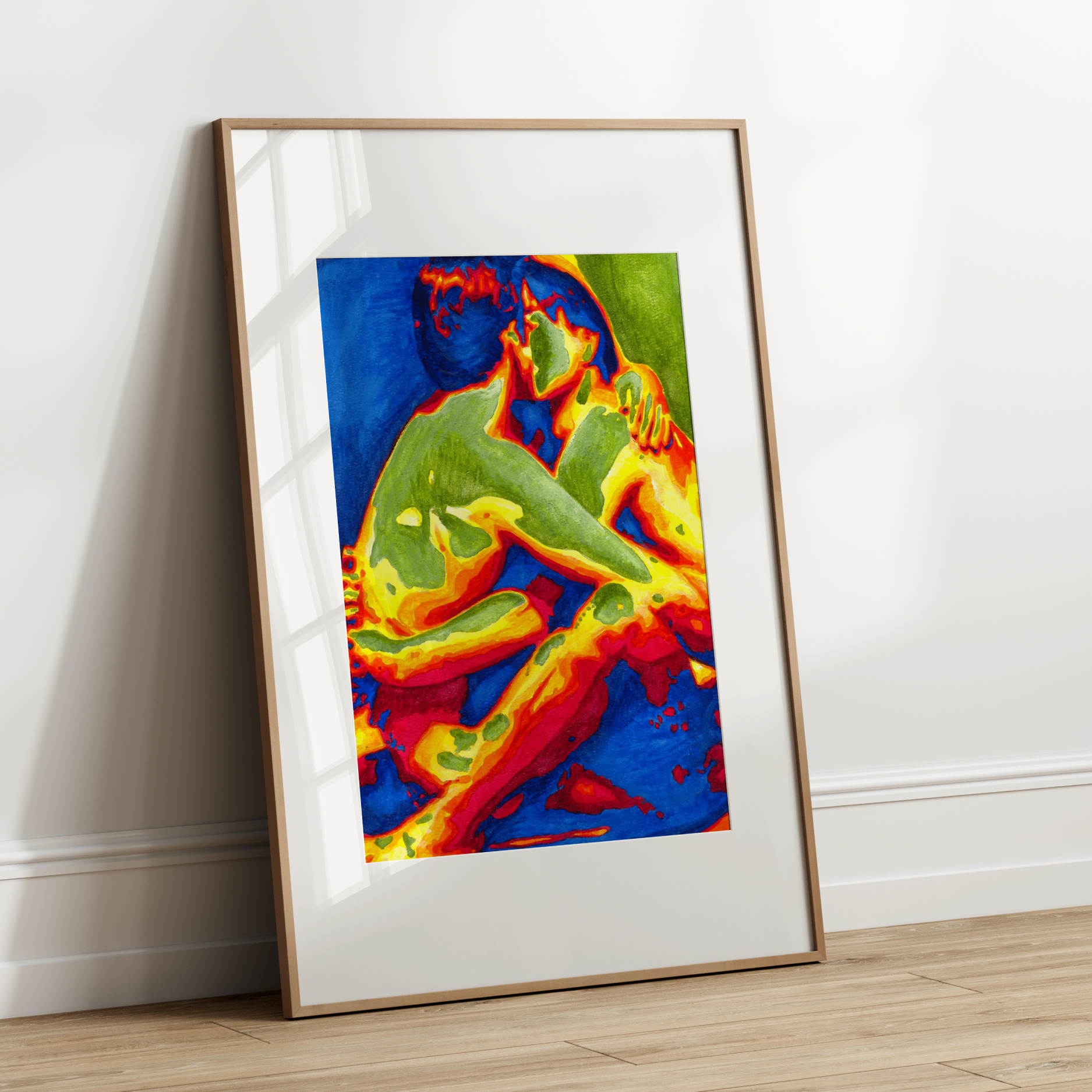 Framed abstract artwork with vibrant colors leaning against a white wall.