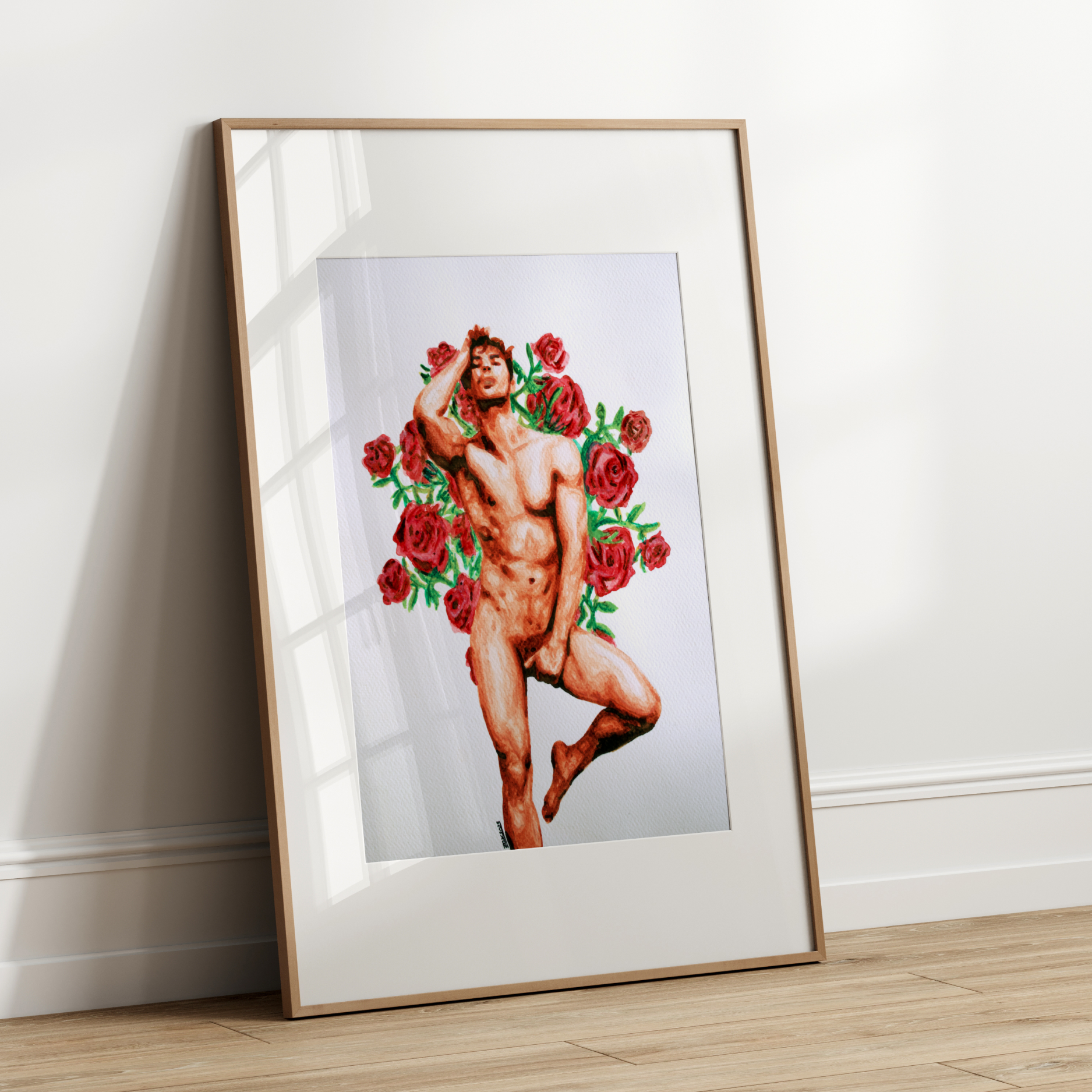 Framed artwork of a nude figure with red roses against a white wall.
