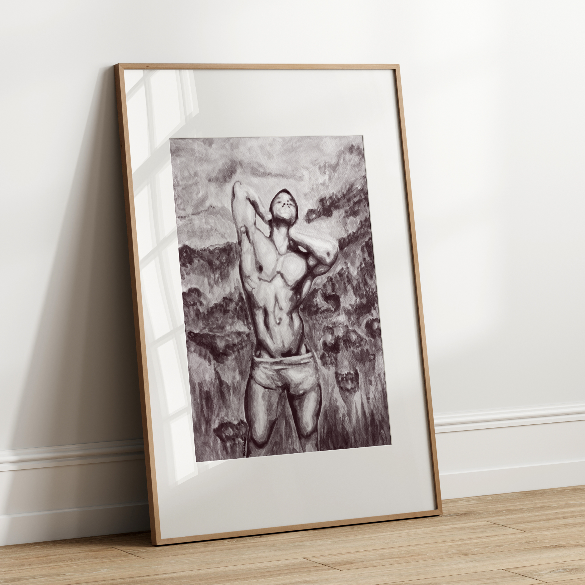 Framed black and white artwork of a person against a plain wall.