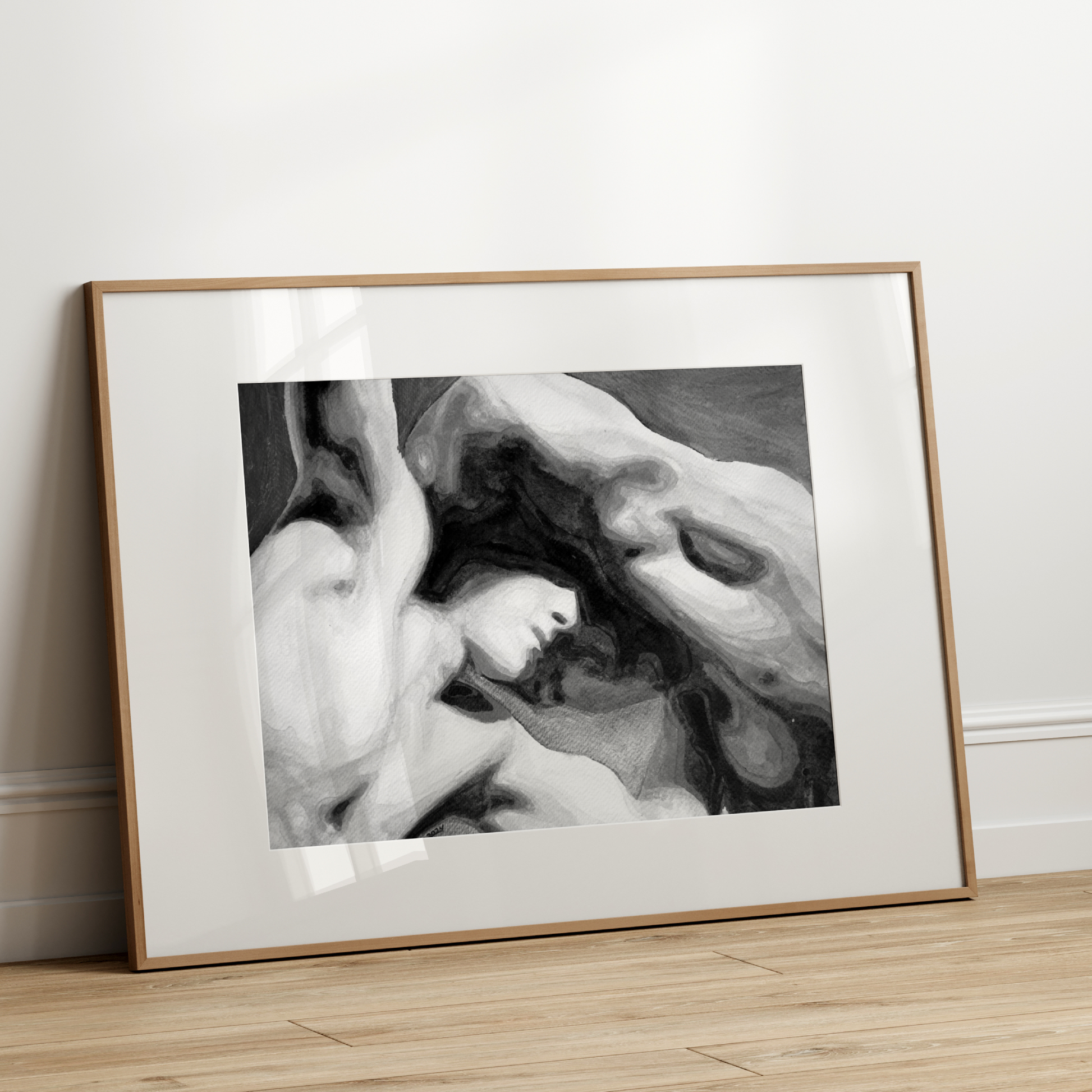 Framed black and white artwork on a wall