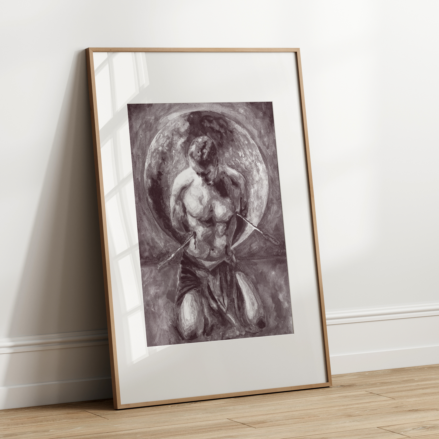 Framed artwork of a classical figure leaning against a white wall.