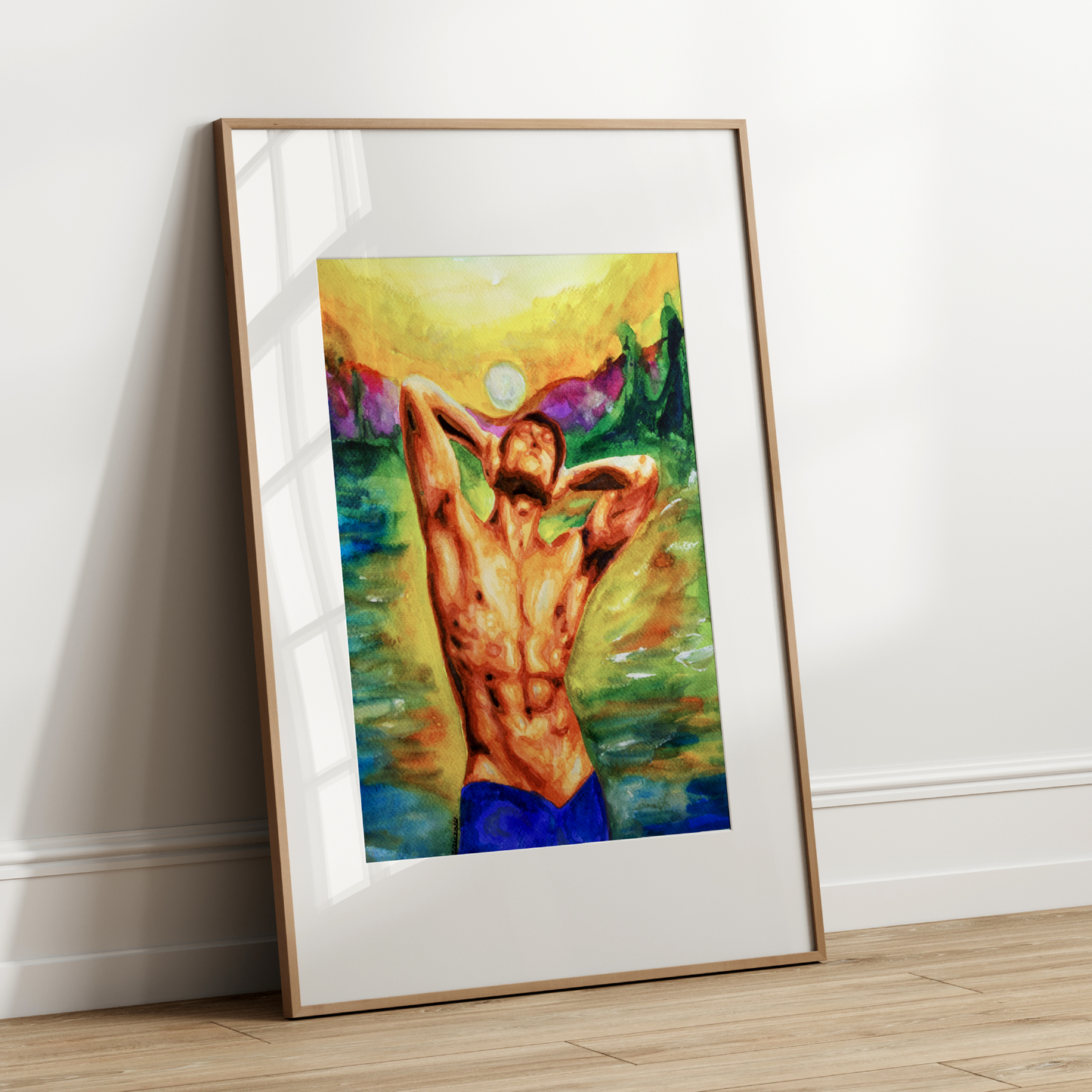 Framed artwork of a nude figure against a colorful abstract background on a white wall.