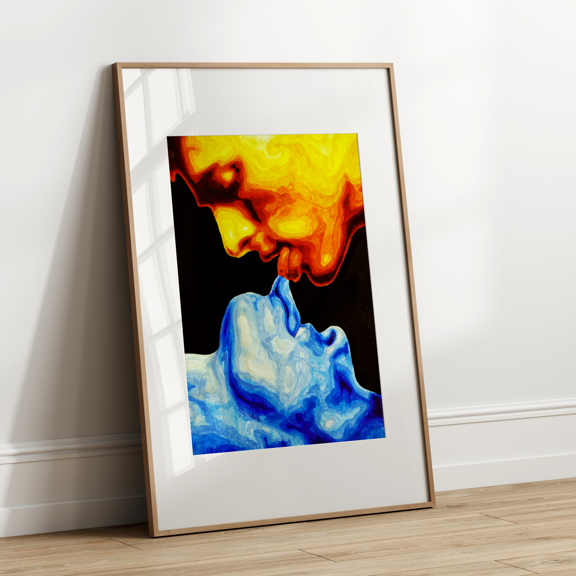 Framed abstract art print with colorful smoke design leaning against a white wall.