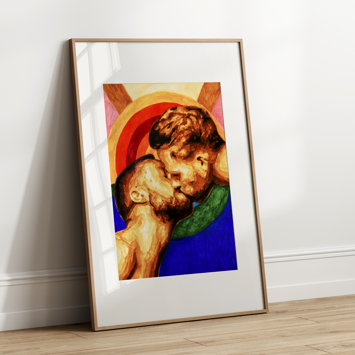 Framed artwork of two children embracing on a white wall.