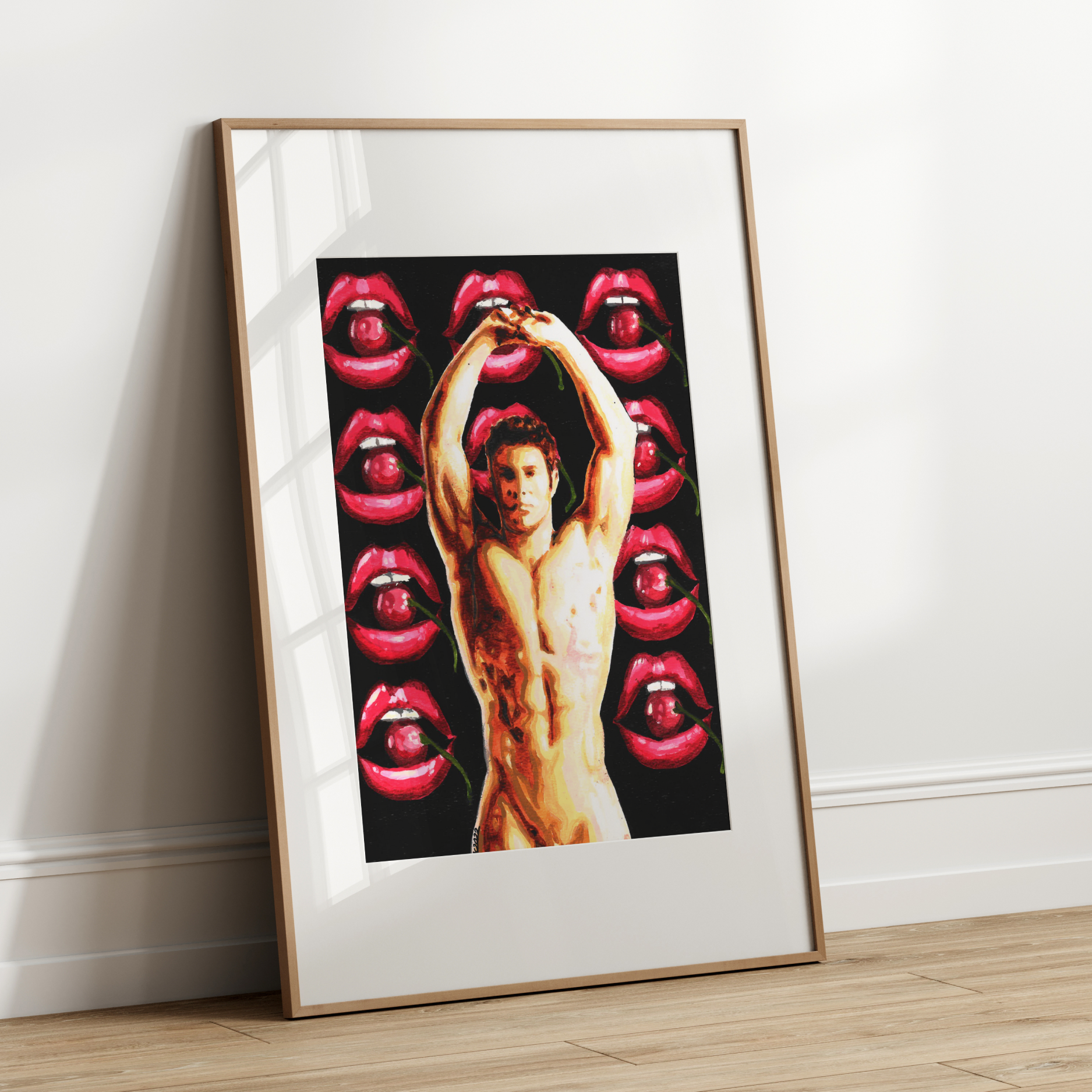 Framed artwork with a central figure and red lips design on a white wall.