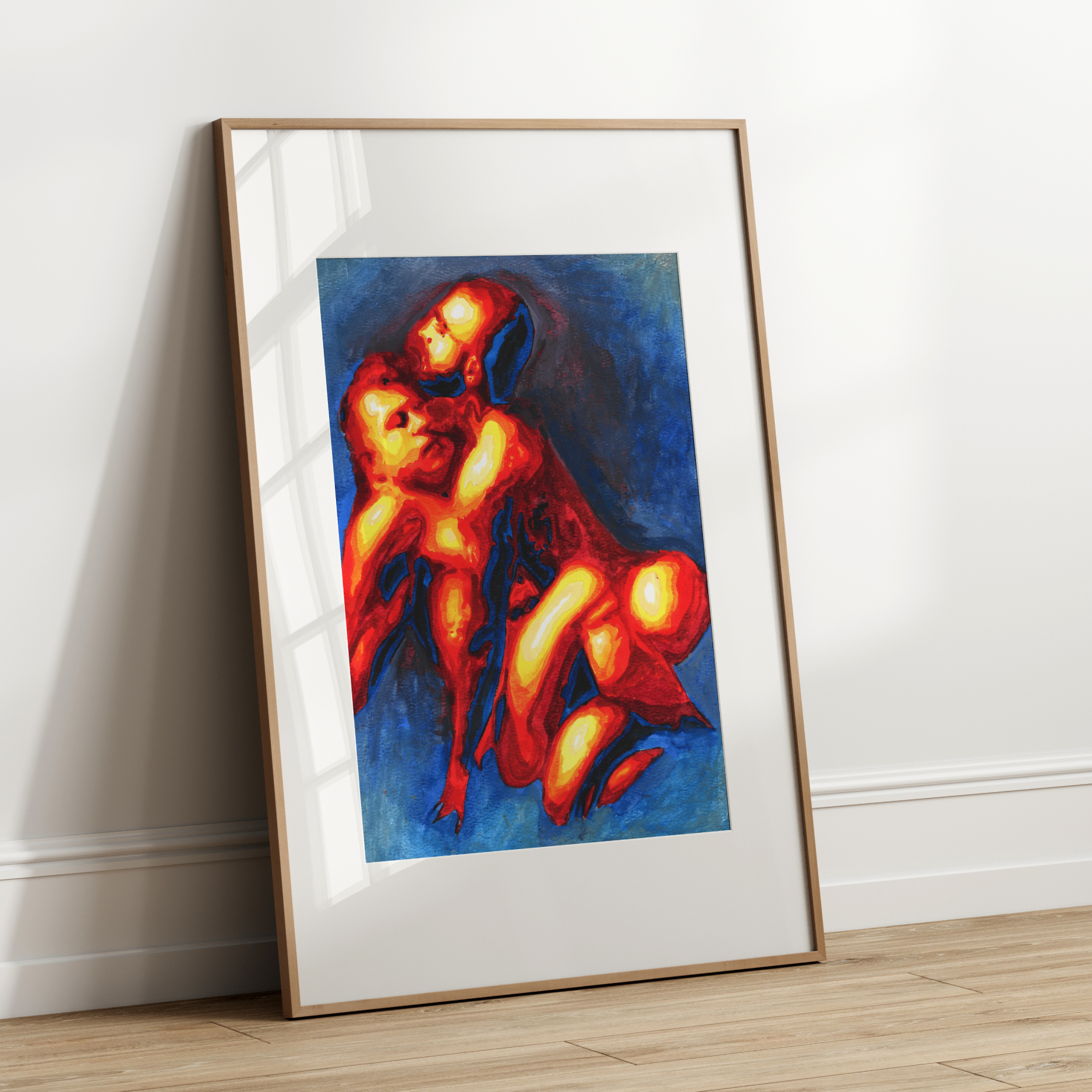 Framed artwork of two people embracing on a white wall.