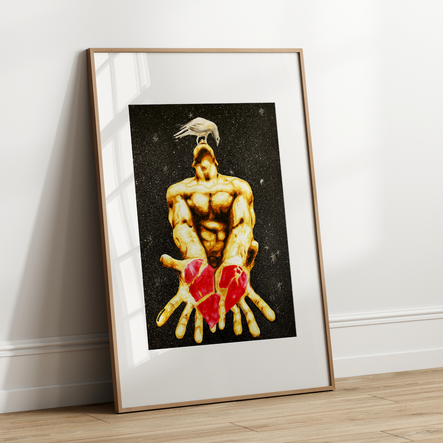Framed artwork of a muscular figure holding red hearts against a black background on a white wall.