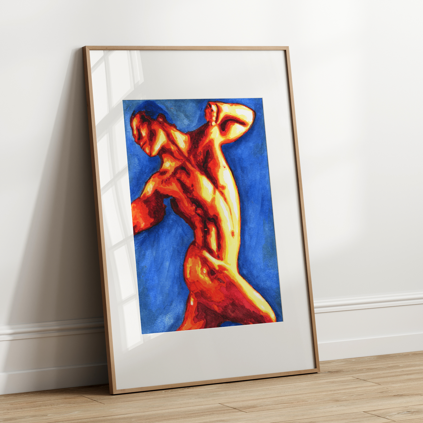 Framed artwork of a nude figure on a white wall
