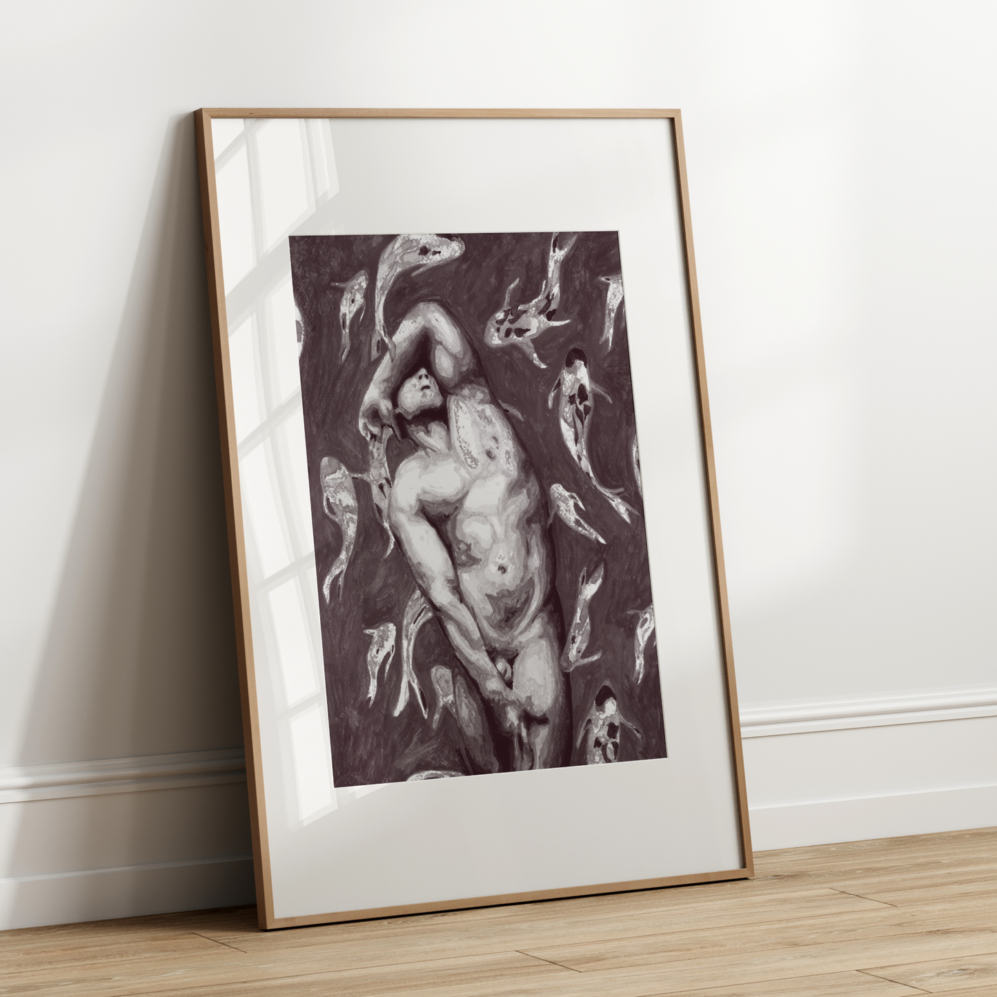 Framed artwork of a nude figure on a white wall