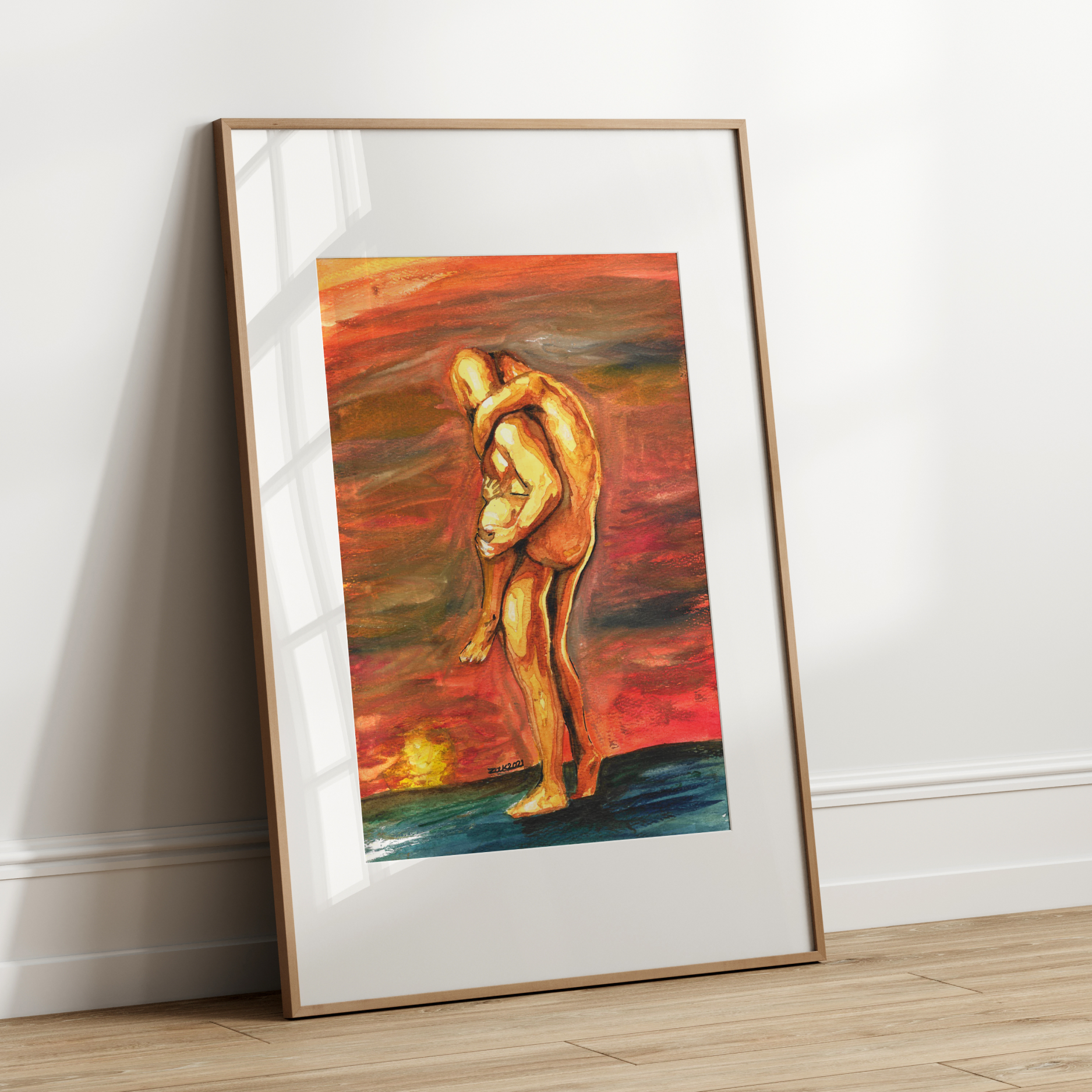 Framed abstract artwork of two figures embracing on a white wall.