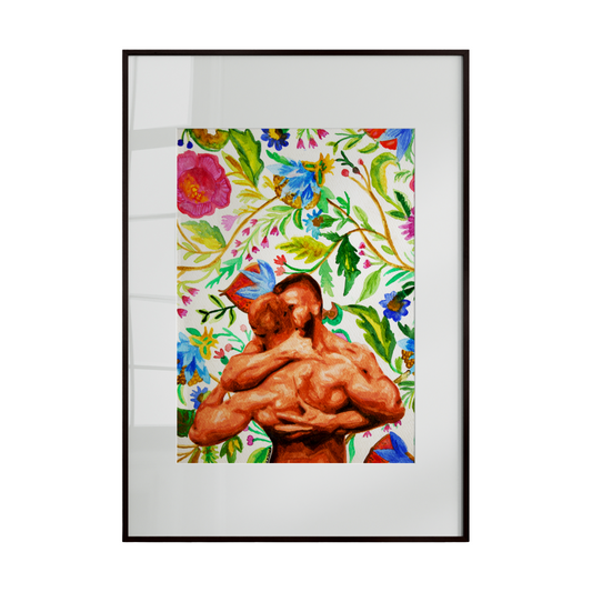 A colorful artistic print of a nude male couple embracing amid a lush backdrop of spring flowers. Framed in a light wooden enclosure, the piece celebrates love, intimacy, and the vibrant beauty of the human form intertwined with nature.