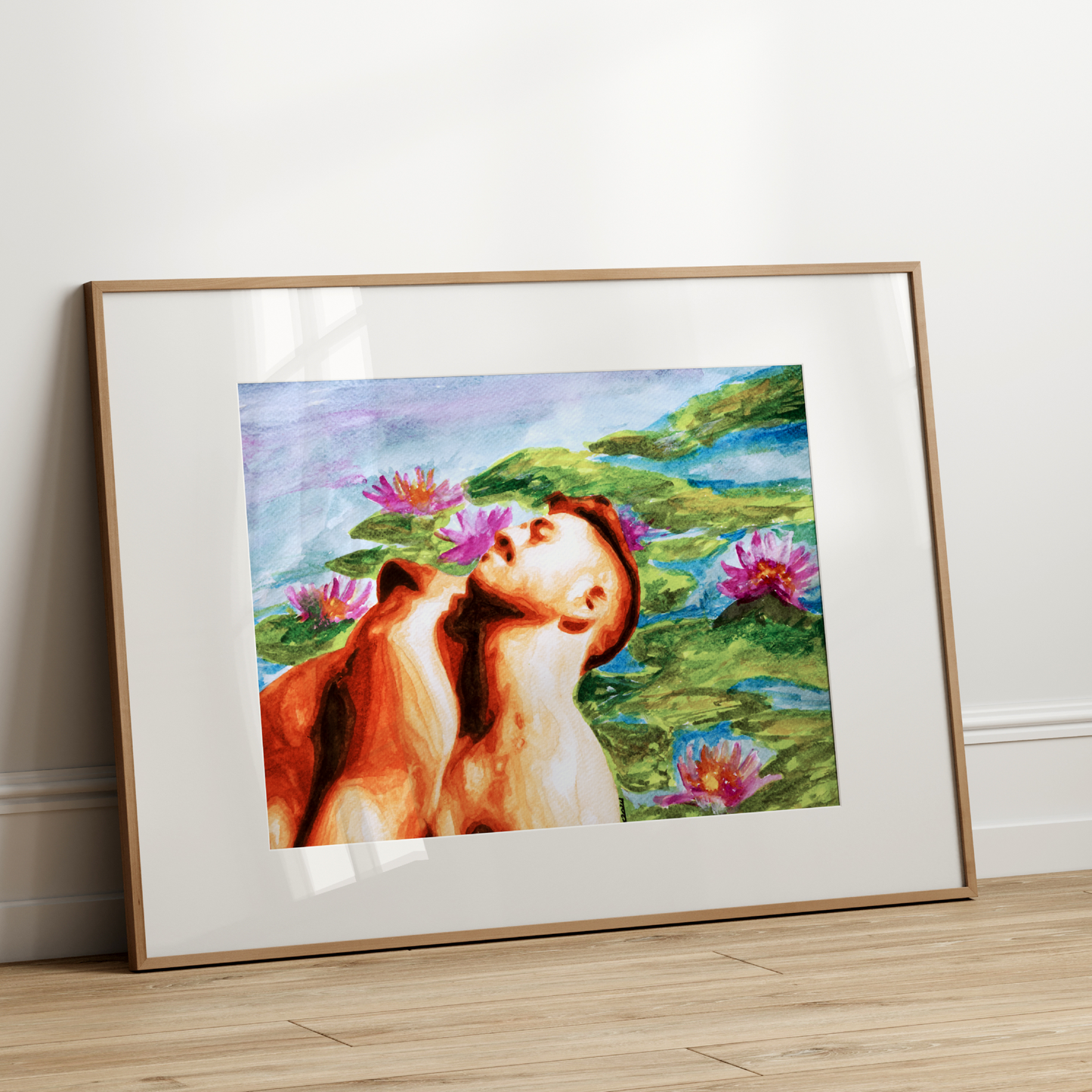 Framed artwork of a woman and horse in a scenic setting on a white wall.