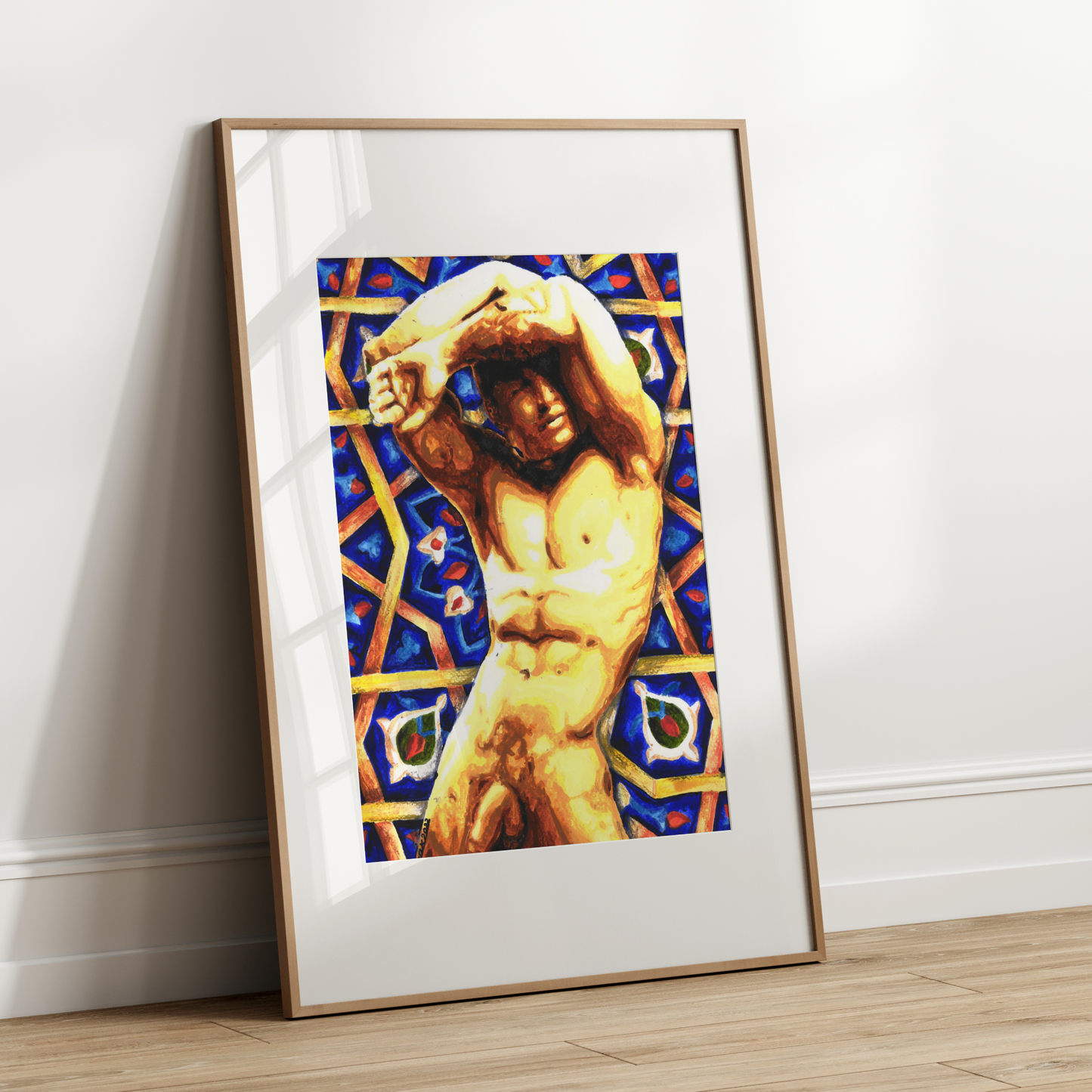 Framed artwork of a nude figure with a colorful geometric pattern on a white wall.