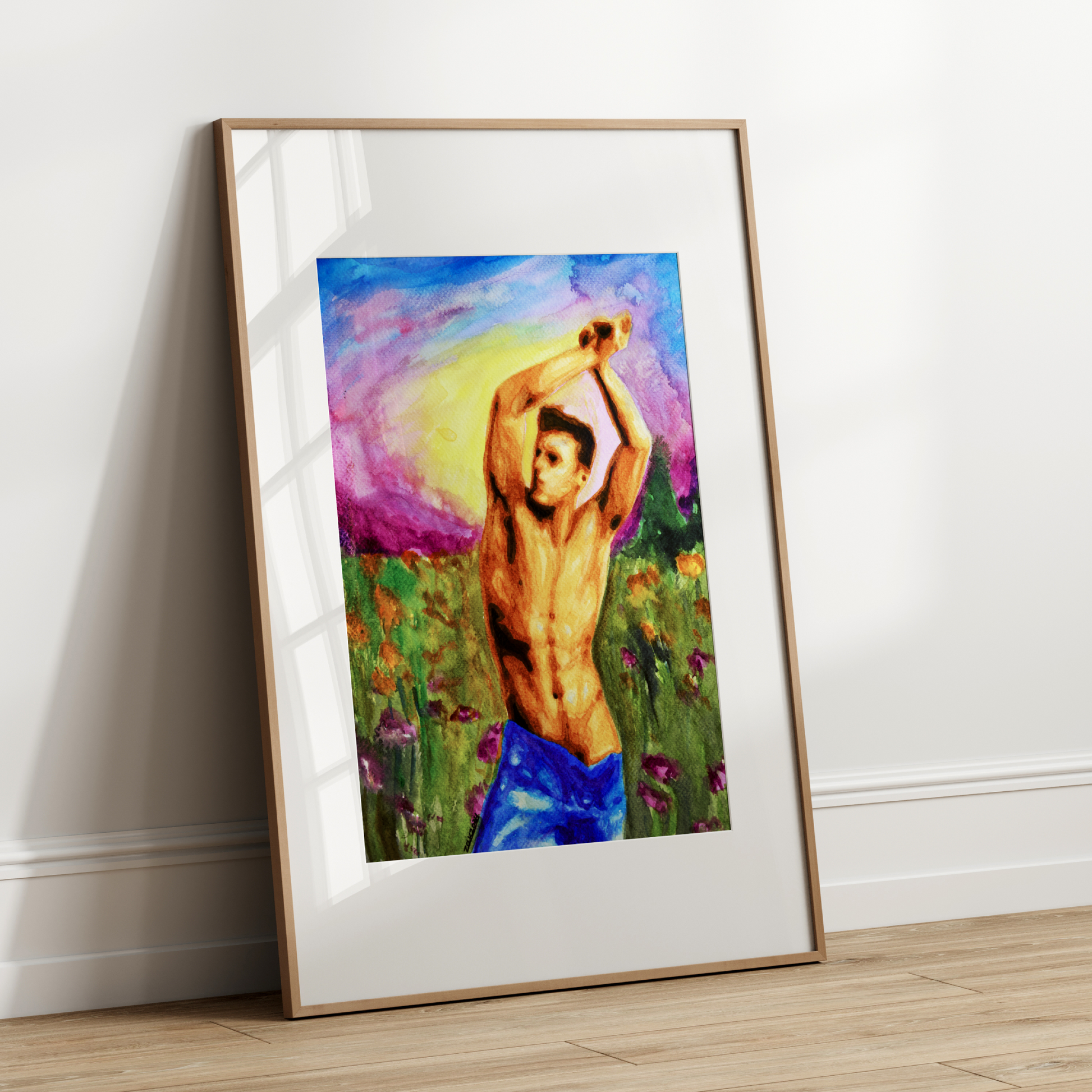 Framed artwork of a shirtless man in a field against a white wall.