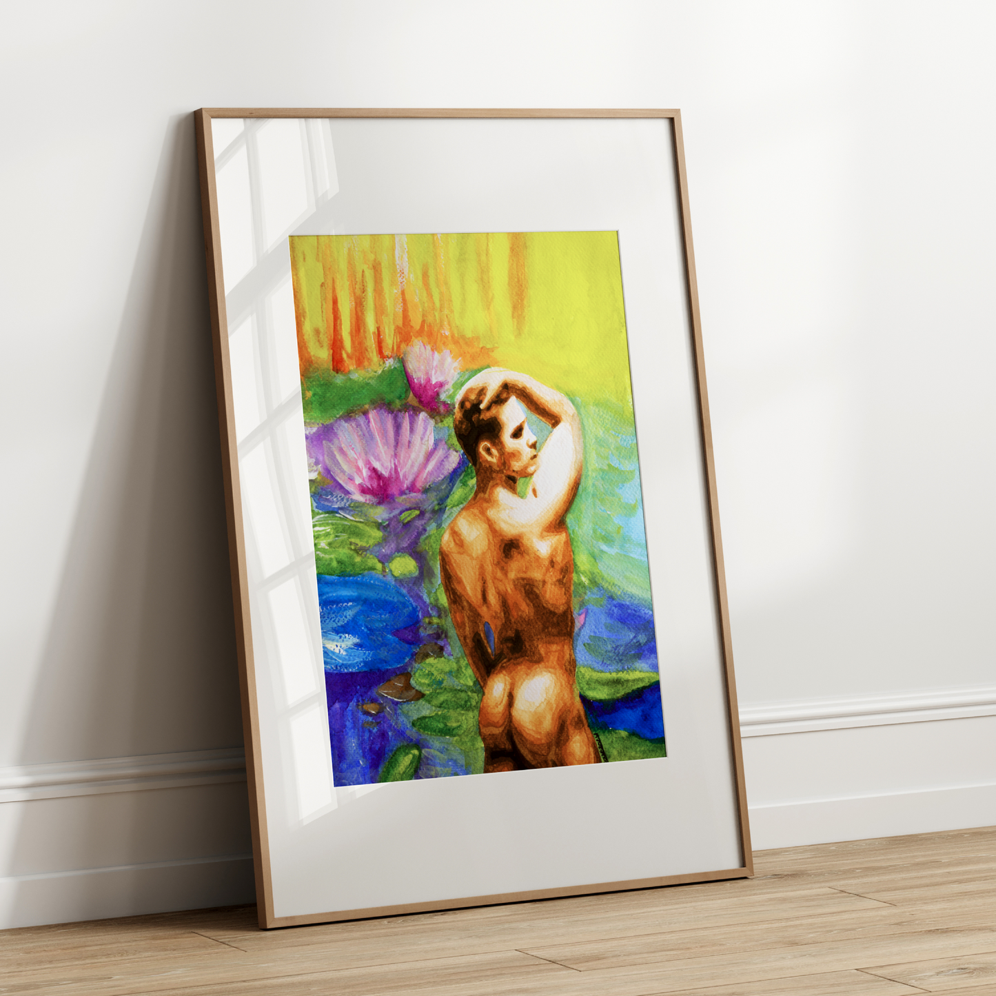 Framed artwork of a nude figure with flowers on a white wall.