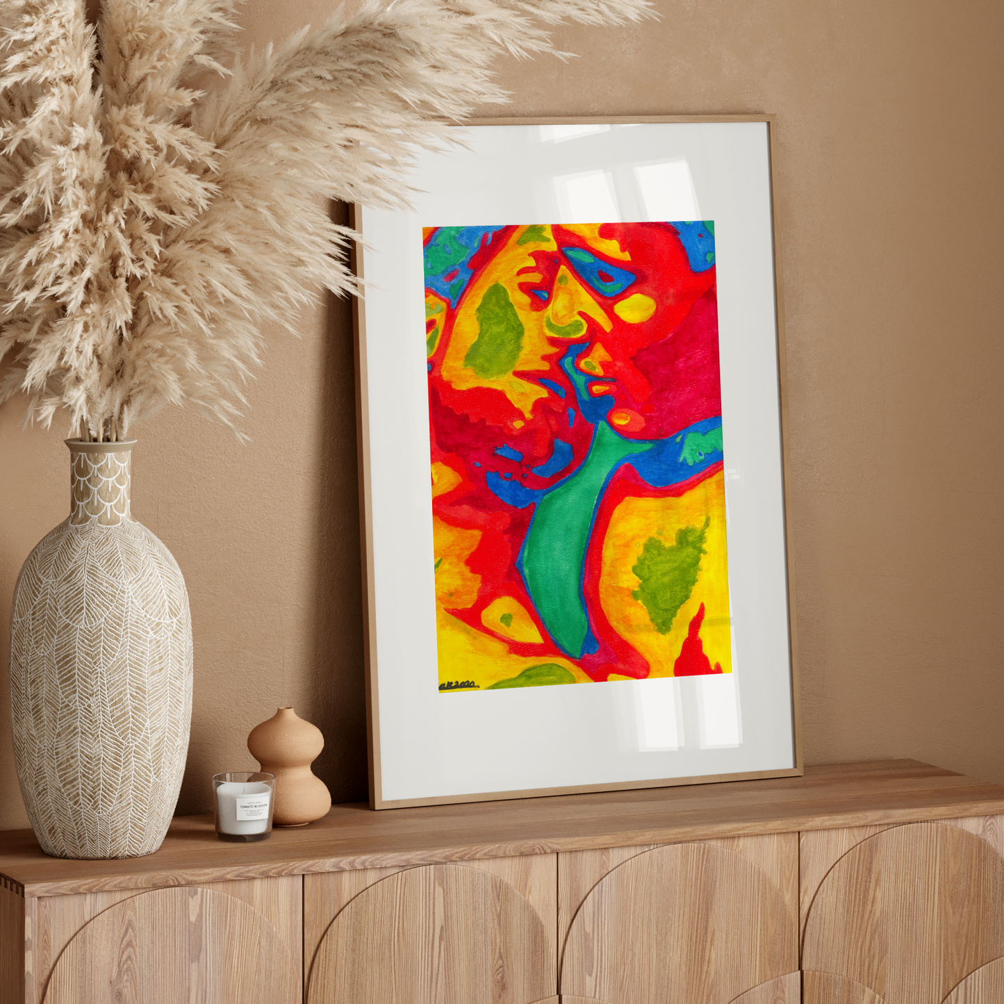 Framed colorful gay couple kissing art print on a white wall