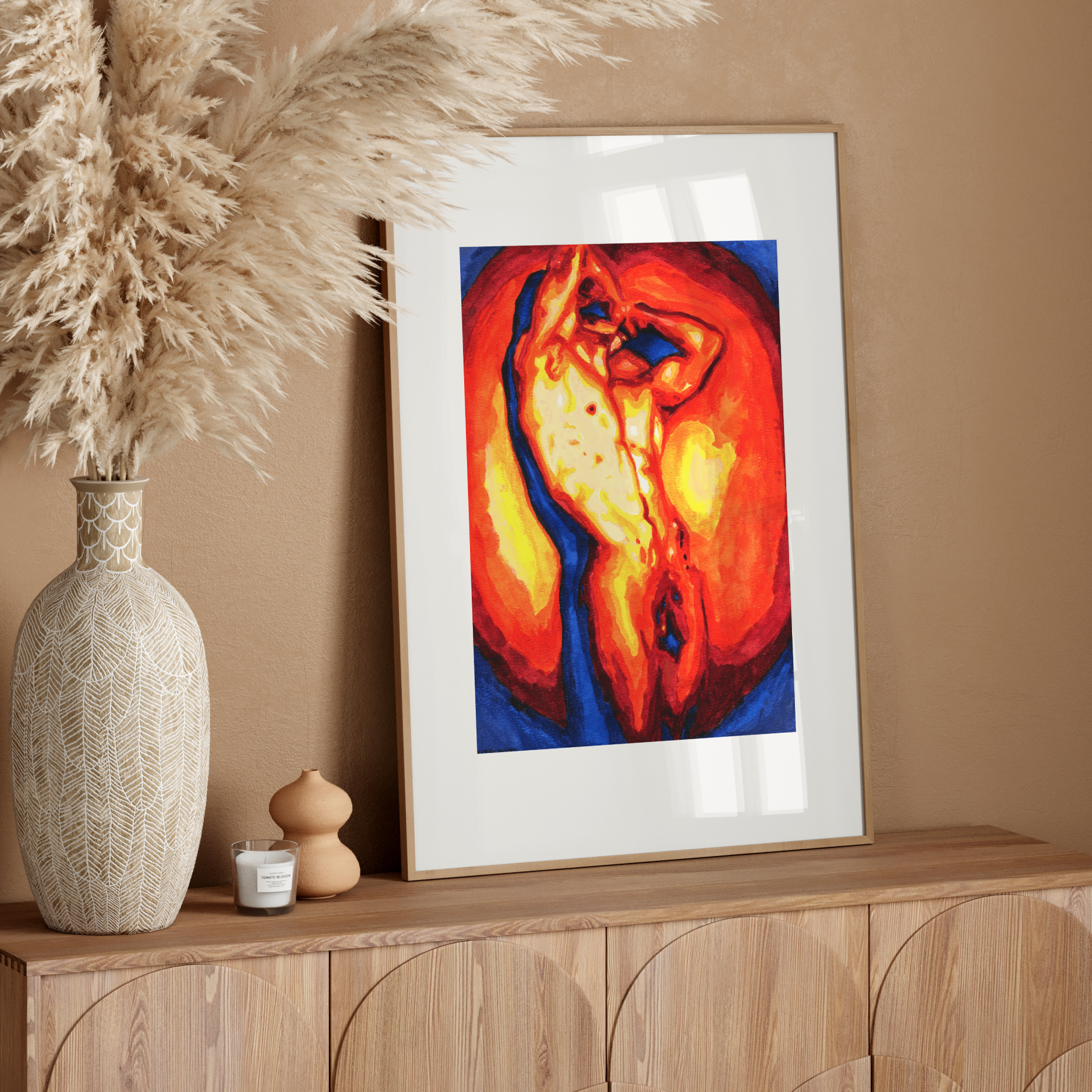 Framed abstract art on a wooden console table with decorative elements.