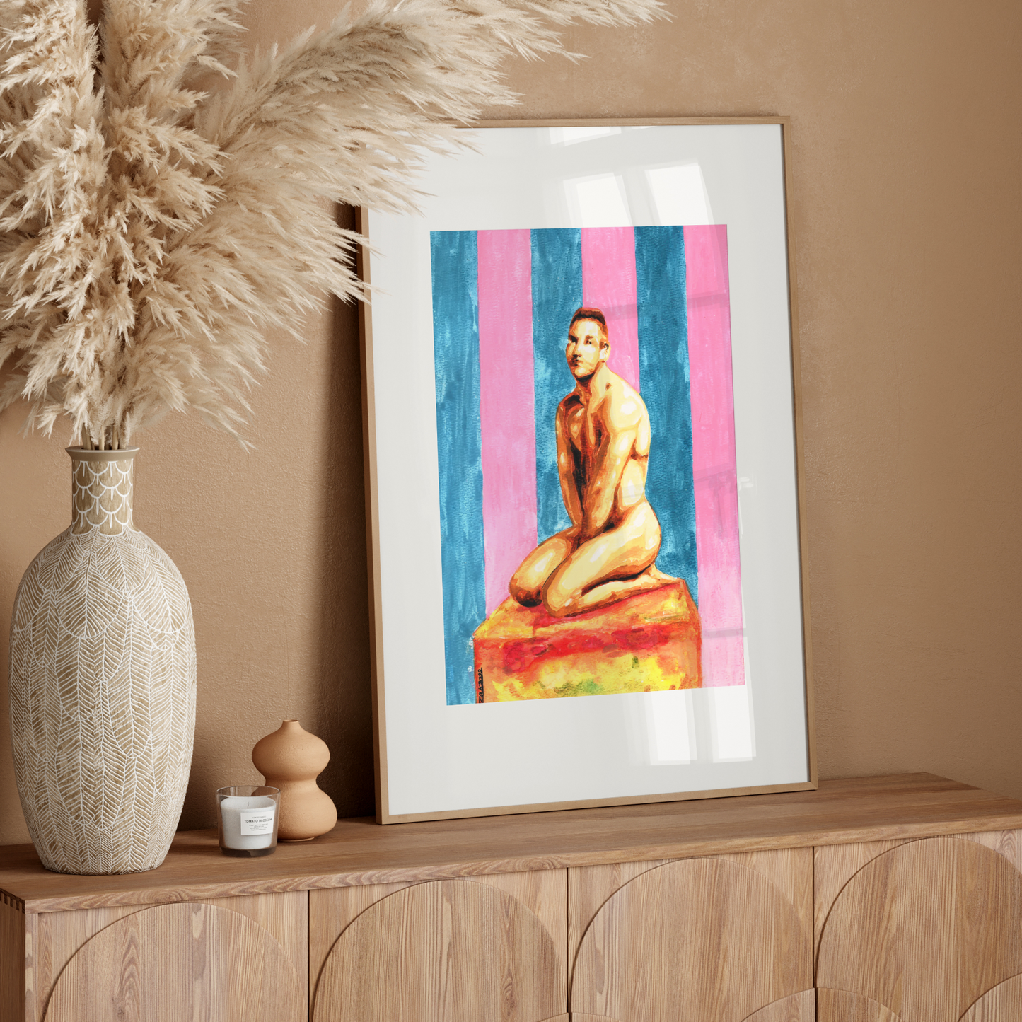 Framed artwork of a nude figure on a wooden sideboard with decorative elements.