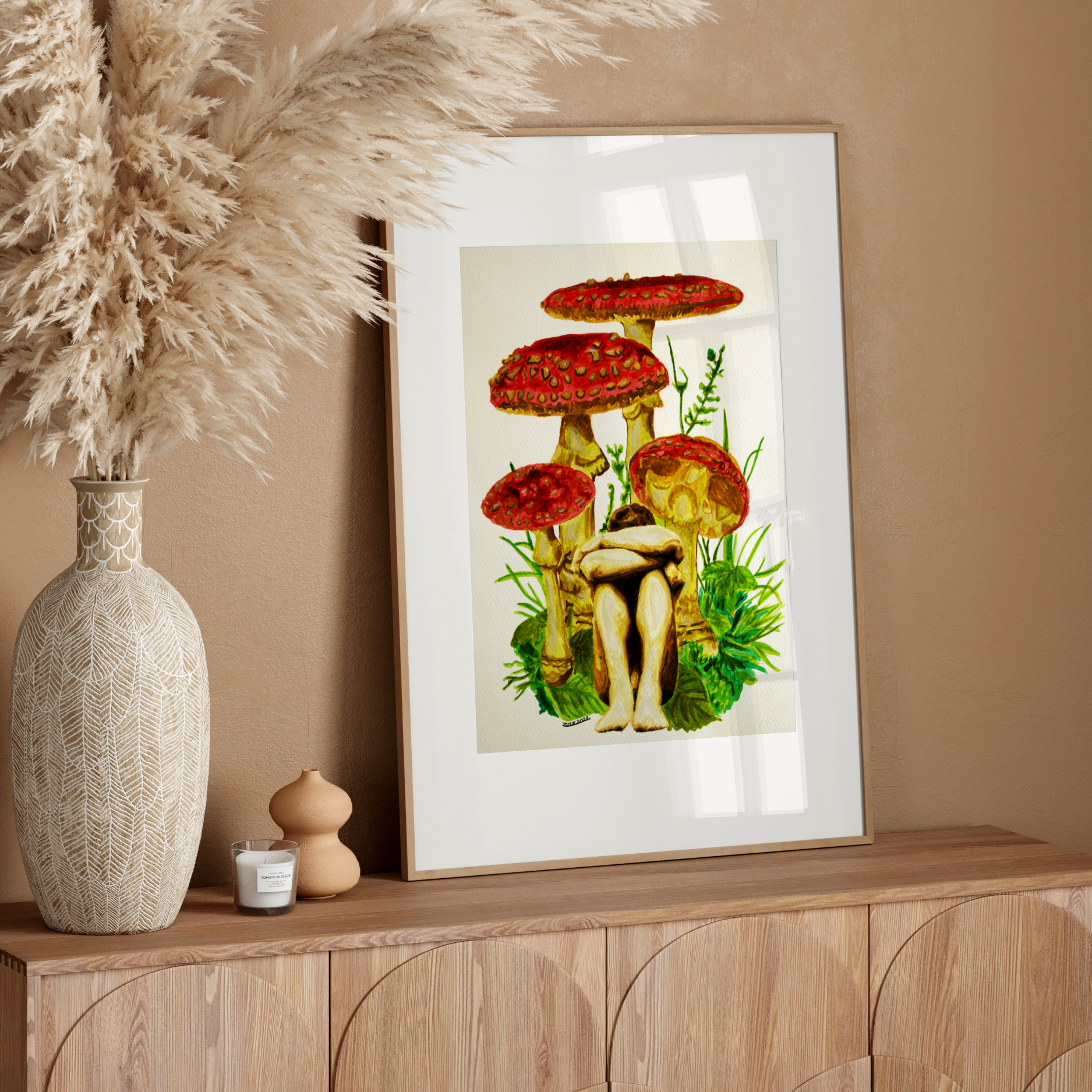 Framed artwork of mushrooms on a wooden sideboard with decorative elements.