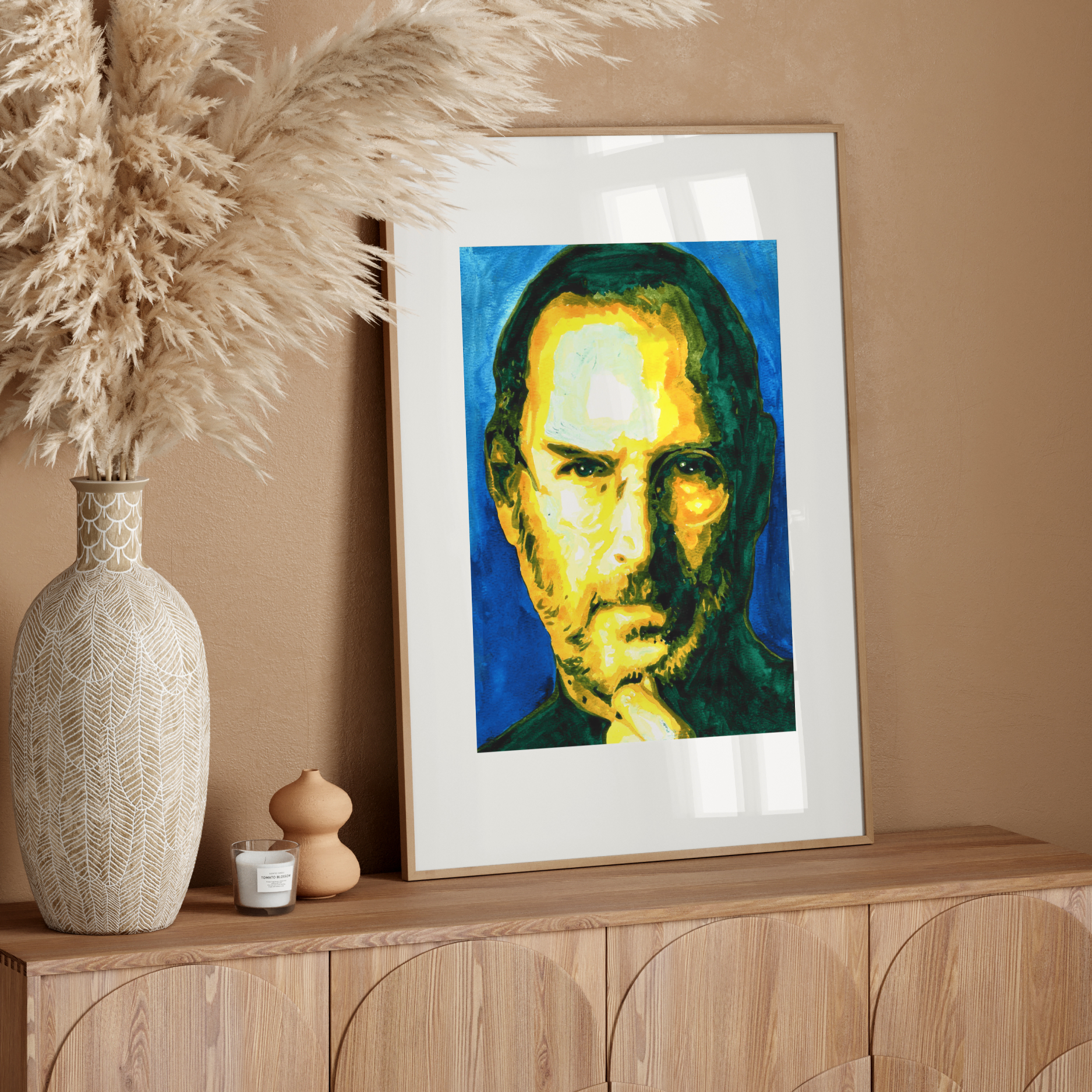 Framed portrait of a person with a colorful background on a white wall
