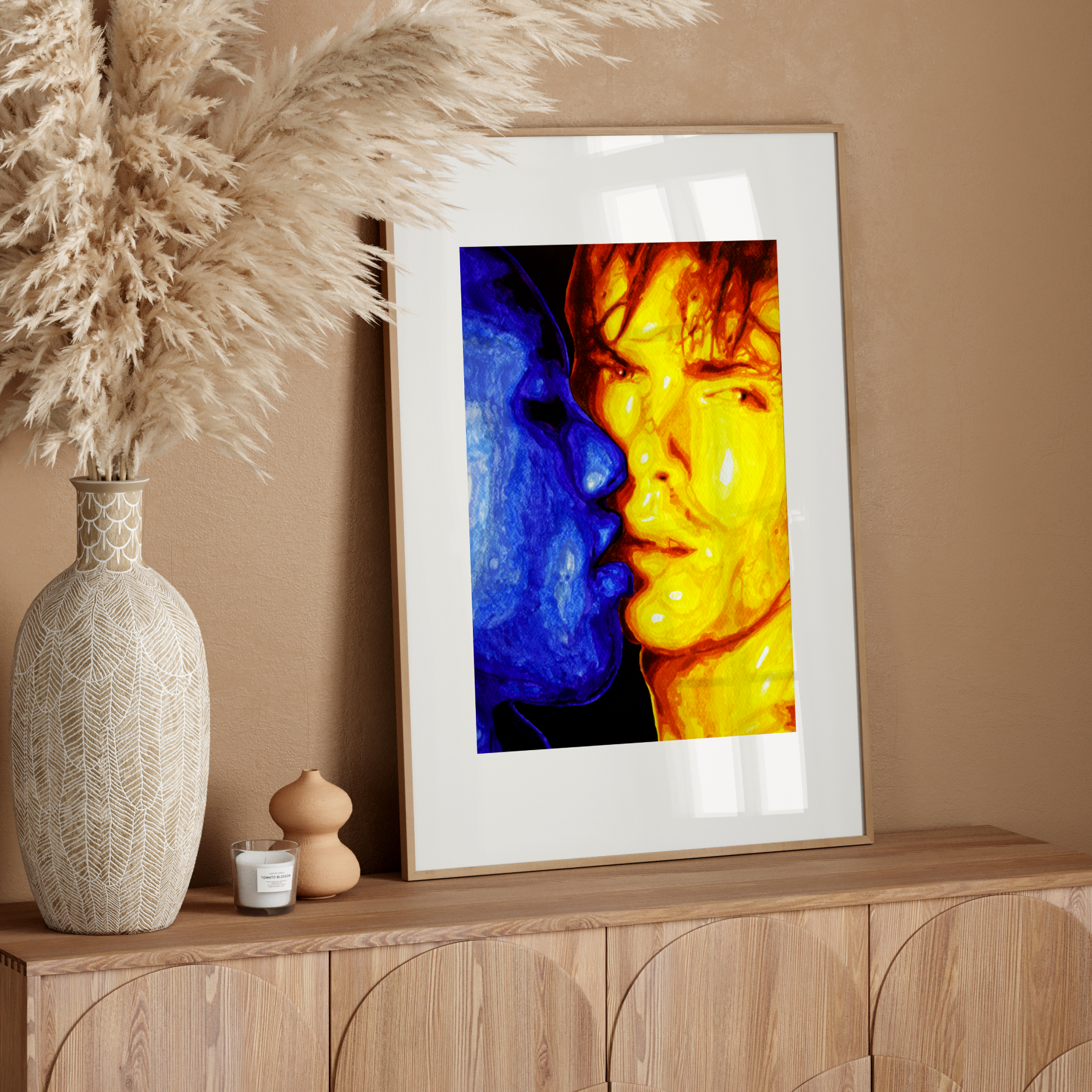 Framed abstract art on a wooden sideboard with decorative elements.