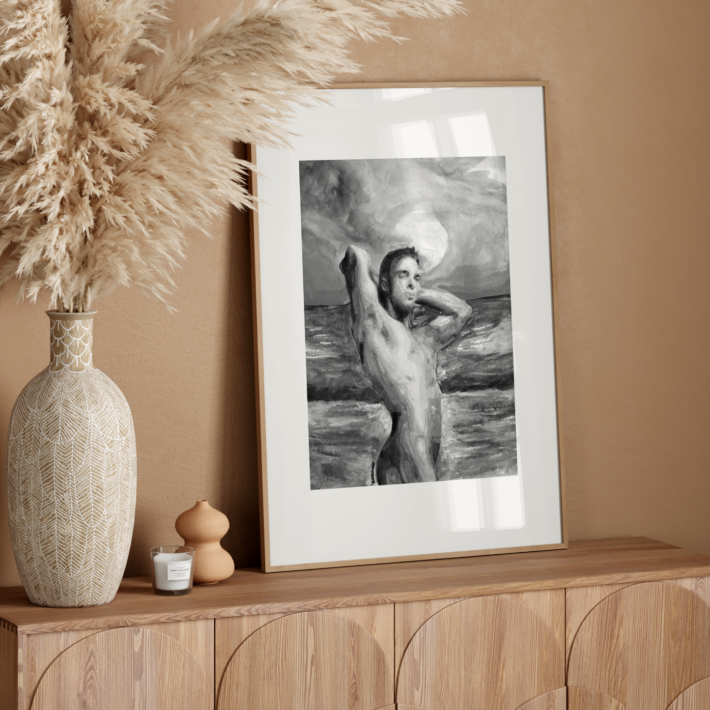 Black and white watercolor painting of a muscular nude man standing by the ocean, flexing his arms behind his head. The silhouette contrasts with a softly textured sky and sea, conveying queer strength, calm, and confidence.