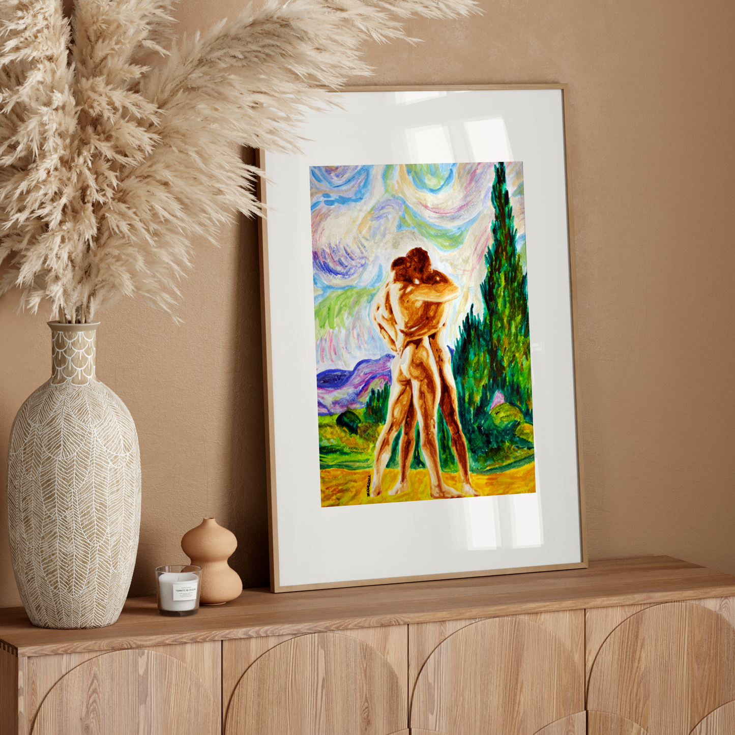 Framed artwork of a couple embracing on a wooden sideboard with decorative elements.