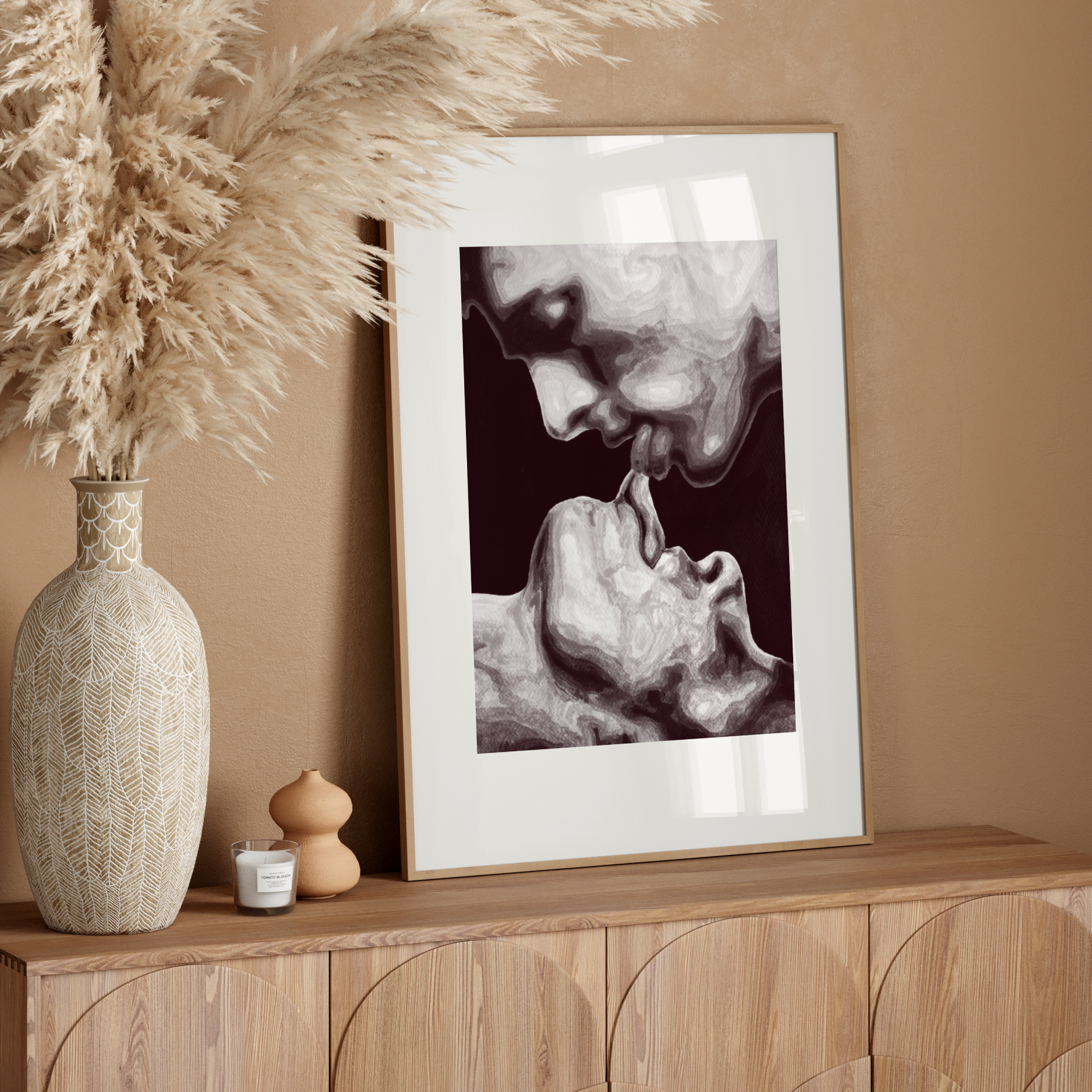 Framed artwork on a wooden console table with decorative elements.